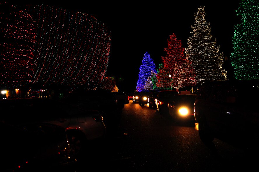 Cars line up to go through the light display at Swan Lake's Iris Gardens, Sumter, S.C. Dec. 1, 2011. Swan Lake's Iris Gardens brightened the holiday with more than 1,000,000 lights, and several food vendors for their opening night. (U.S. Air Force photo by Airman 1st Class Ashley L. Gardner/ Released)