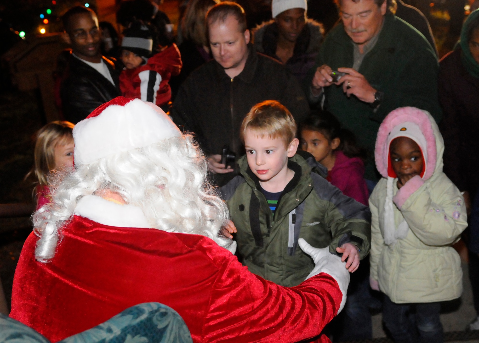 Sawyer Martin, 3, gets his chance to talk to Santa. U. S. Air Force photo by Sue Sapp