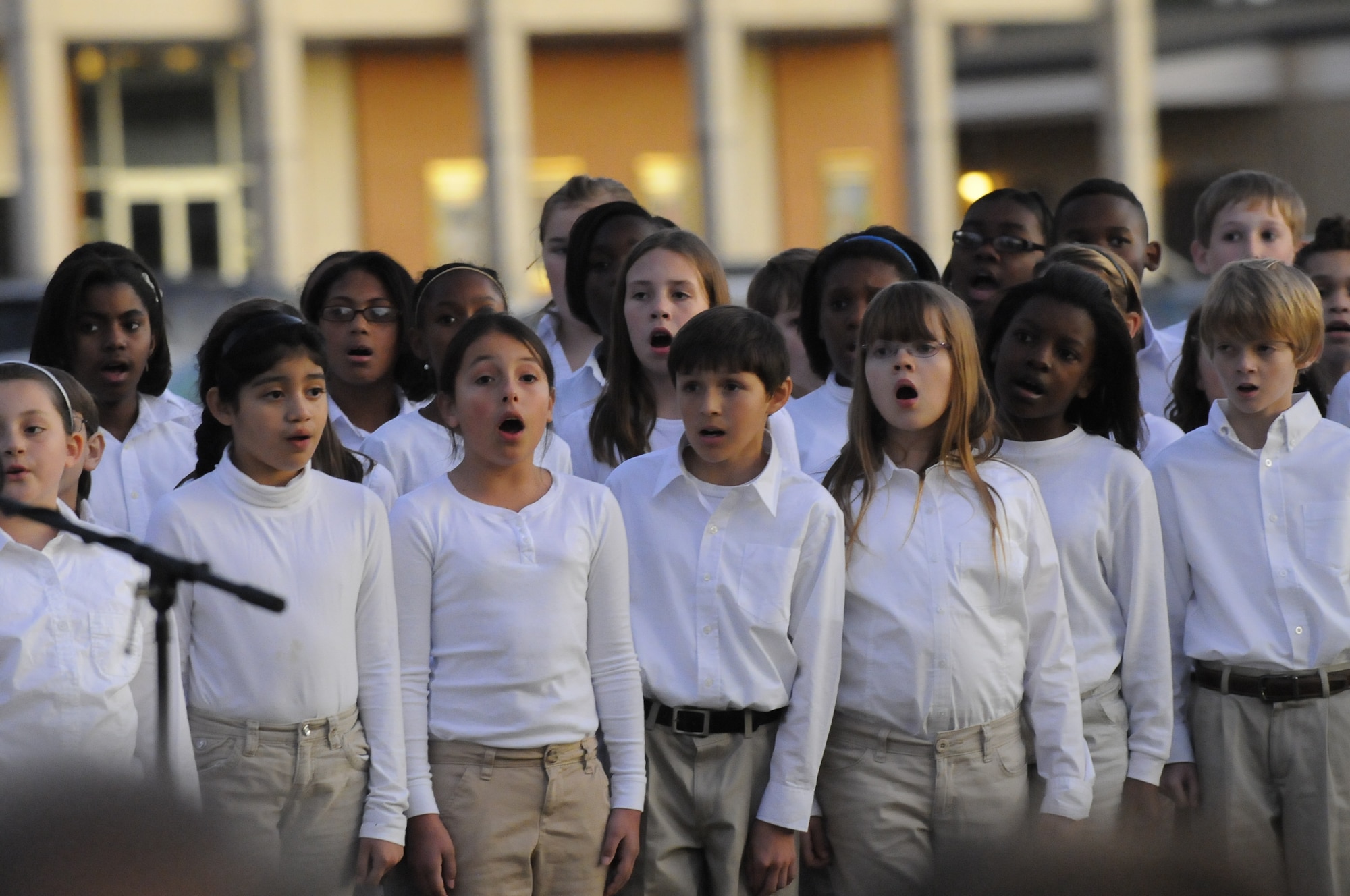 Members of Lake Joy Elementary chorus under the direction of Bobby Helms sing at the Chapel Tree Lighting ceremony Dec. 1. U. S. Air Force photo by Sue Sapp
