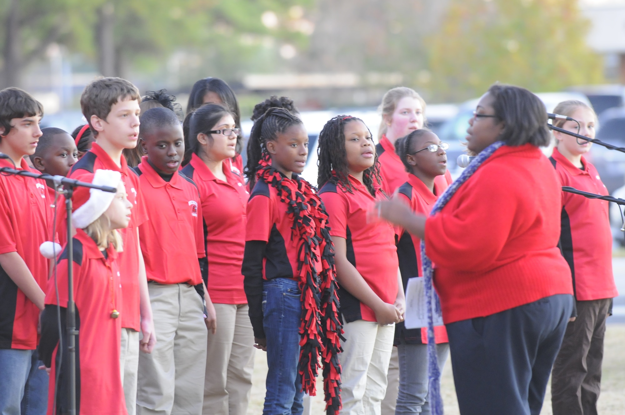 Members of  Huntington Middle School chorus under the direction of Quin Kearse sing at the Chapel Tree Lighting ceremony Dec. 1. U. S. Air Force photo by Sue Sapp 