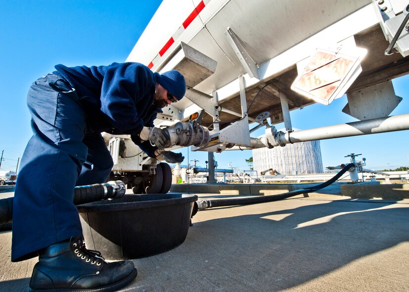 Mike White, a contractor with Maytag Aircraft Corp., removes the seal from a tanker truck filled with JP-8, before offloading it into a fuel bulk storage tank at Eglin Air Force Base, Fla.  Air Force fuel bulk storage areas are maintained exclusively by contractors.  (U.S. Air Force photo/Samuel King Jr.)