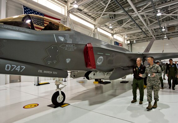 Master Sgt. Scott Grabham, from the 33rd Aircraft Maintenance Squadron, briefs Gen. Mike Hostage, the commander of Air Combat Command, on the capabilities of the F-35 Lightning II, Nov. 30.  The 33rd Fighter Wing, at Eglin Air Force Base, Fla., is the only DOD unit to have the joint strike fighter in its inventory.  (U.S. Air Force photo/Samuel King Jr.)