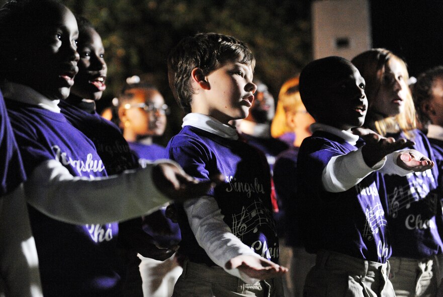 Kingsbury Elementary School choir sings Christmas jingles during the 24th Annual Fantasy of Lights at Swan Lake Iris Gardens in Sumter, S.C., Dec. 1, 2011. The Fantasy of Lights is one of the largest free lighted displays in South Carolina since 1989.(U.S. Air Force photo by Airman 1st Class Tabatha Duarte/Released)