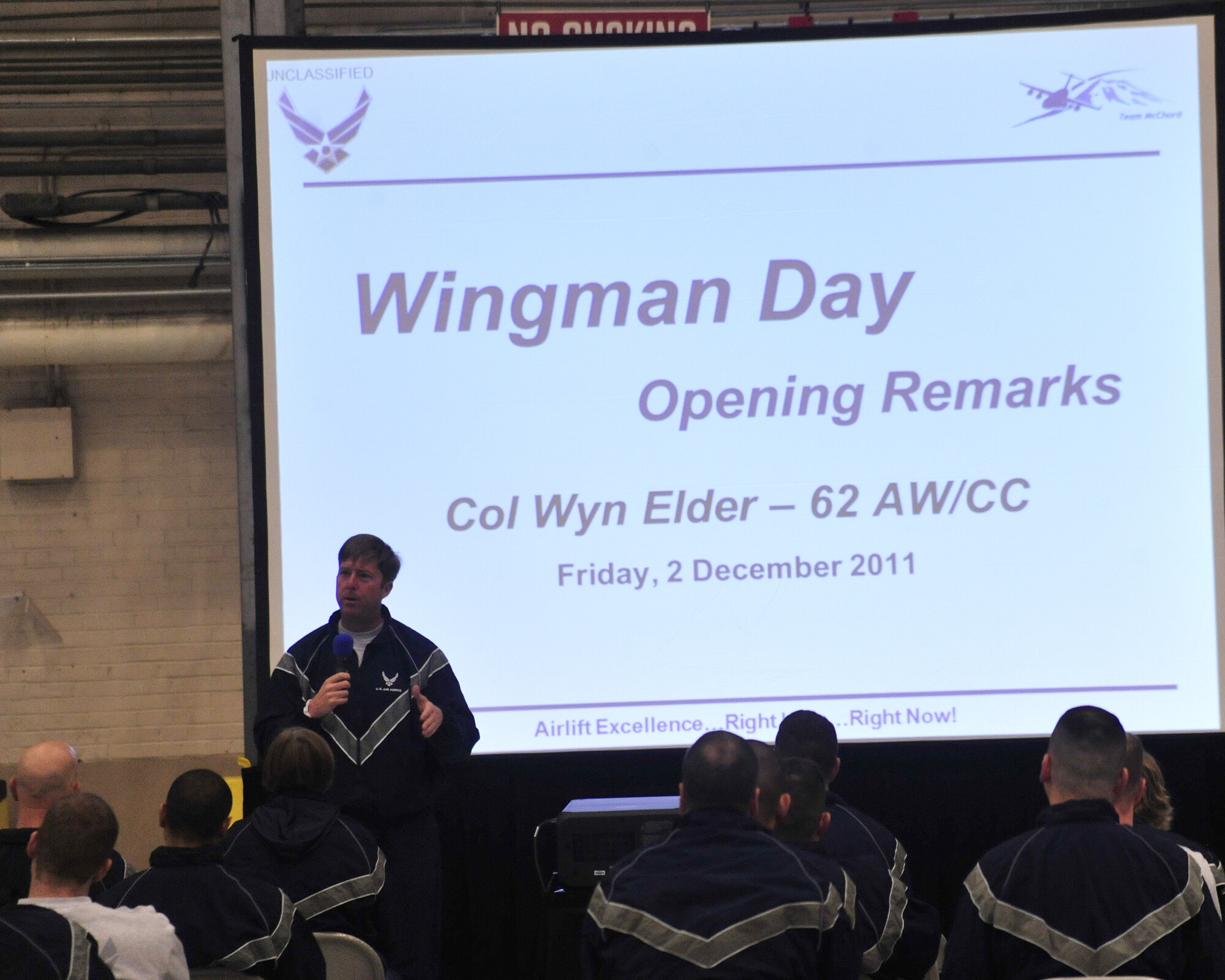 Col. Wyn Elder, 62nd Airlift Wing commander, kicks off Wingman Day Dec. 2, 2011 at Joint Base Lewis-McChord, Wash. The goal of the day is to build resilient Airmen and focus on unit health through the Resiliency Program. (U.S. Air Force photo/Staff Sgt. Frances Kriss)