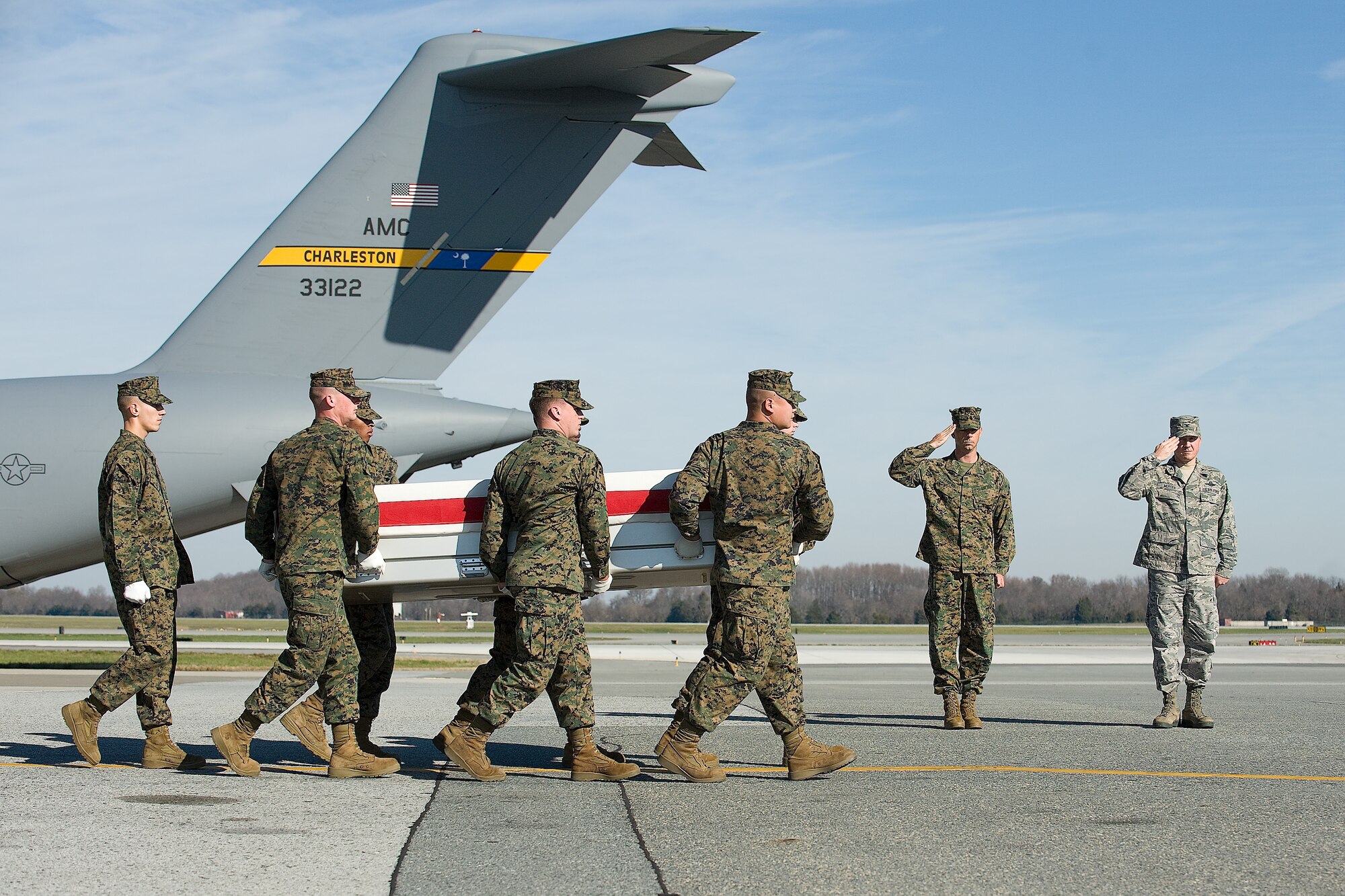A U.S. Marine Corps carry team transfers the remains of Marine Staff Sgt. Vincent J. Bell, of Detroit, Mich., at Dover Air Force Base, Del., Dec. 2, 2011. Bell was assigned to the 2nd Battalion, 11th Marine Regiment, 1st Marine Division, I Marine Expeditionary Force, Camp Pendleton, Calif. (U.S. Air Force photo/Steve Kotecki)