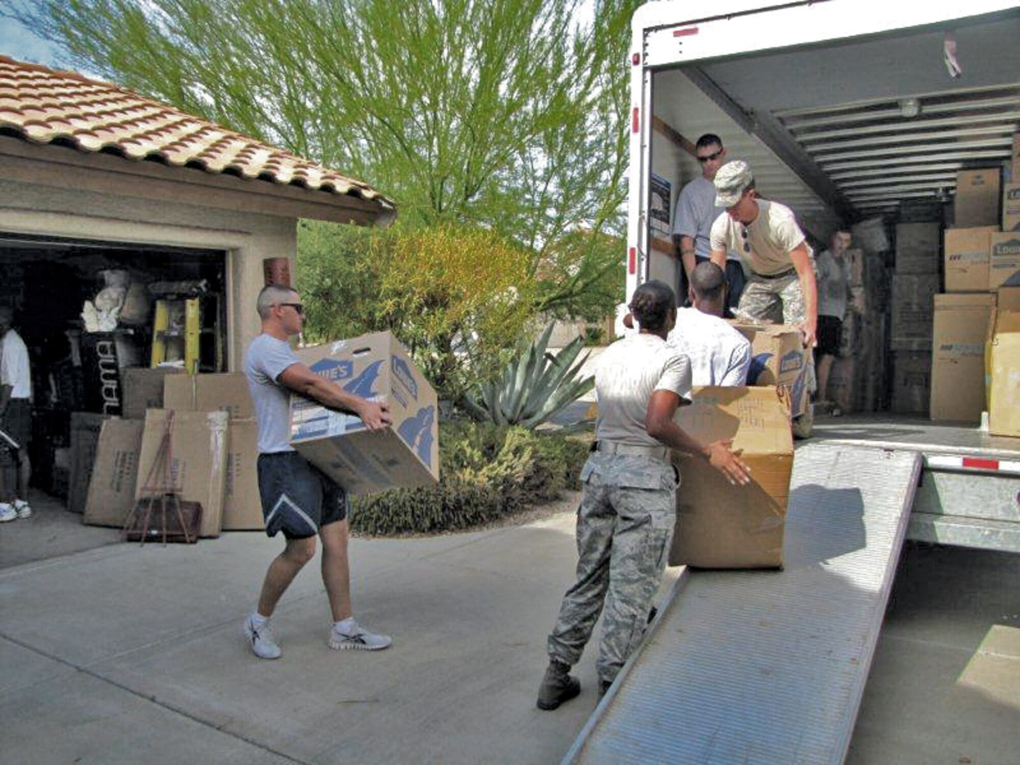 Luke Air Force Base members assist a wounded warrior pack for a move to San Antonio. Participating were Senior Master Sgt. Eric Culver, 56th Force Support Squadron superintendent, who handled the volunteer tasking; Tech. Sgts. Lyndsey Lemus and Carolyn Russell, 56th FSS Airman Leadership School; Staff Sgts. Brian Tisdall, 56th FSS ALS, Gerard Tilley, 56th Equipment Maintenance Squadron, Daniel Bays, 56th FSS Honor Guard and Clinton Wellman, 756th Aircraft Maintenance Squadron; Senior Airmen Darryl McNeil, Travis Grasmick, 56th EMS, Caleb Odom, 756th AMXS, William Canfield, 56th AMXS, Andrew Leaver, 56th Component Maintenance Squadron, and Kory Hitchens, 56th Operations Support Squadron; and Airmen 1st Class, Brian Speaks, 56th EMS, and Benjamin McCloud, 607th ACS. (Courtesy photo)