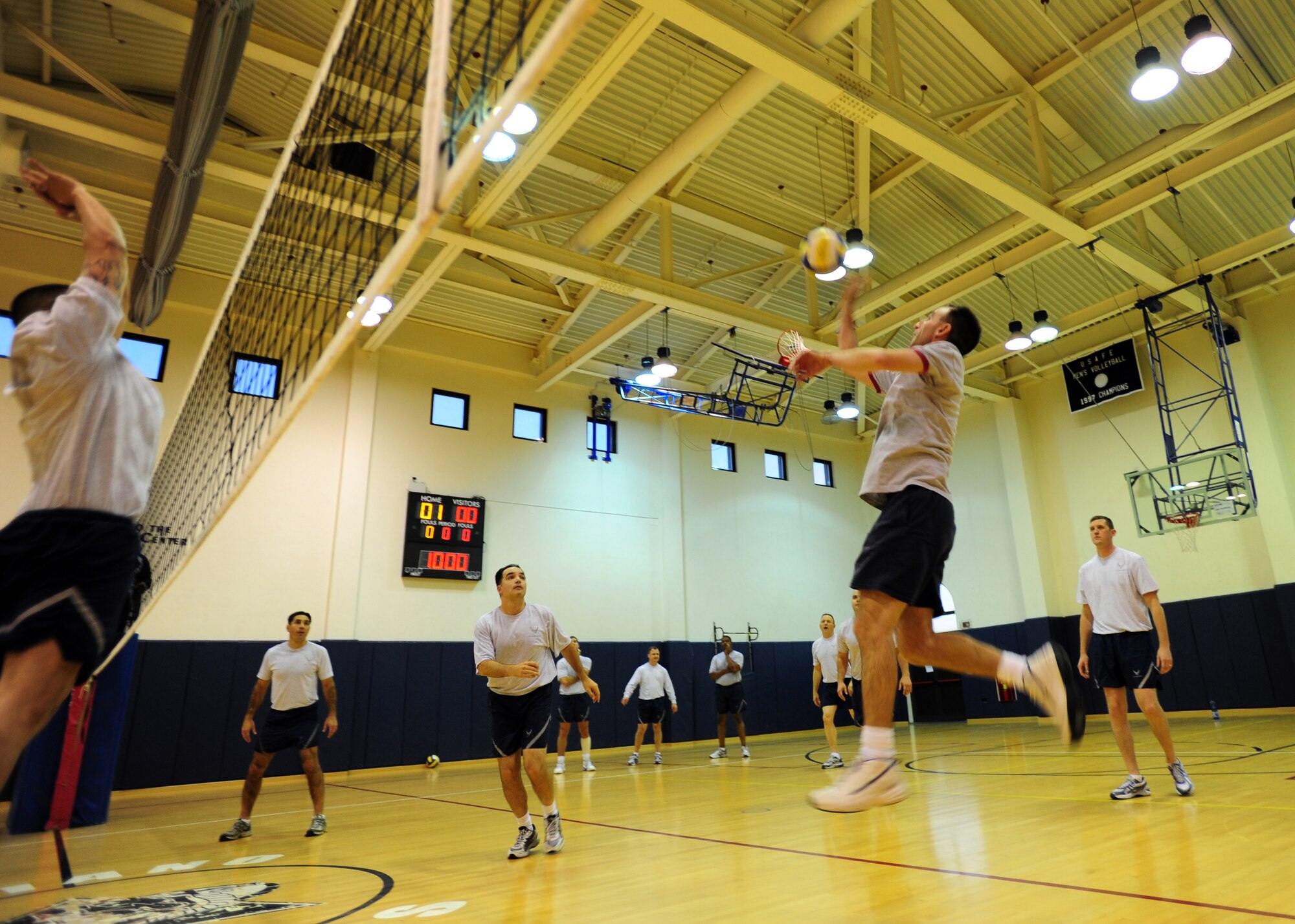 Brig. Gen. Scott Zobrist, 31st Fighter Wing commander, spikes the ball in a volleyball game Dec. 1 in the Dragon Fitness Center at Aviano Air Base, Italy. Zobrist participated in the traditional Airman Leadership School volleyball game against the commanders, in which ALS class 12B was defeated. (U.S. Air Force photo/Airman 1st Class Jenay Randolph)
