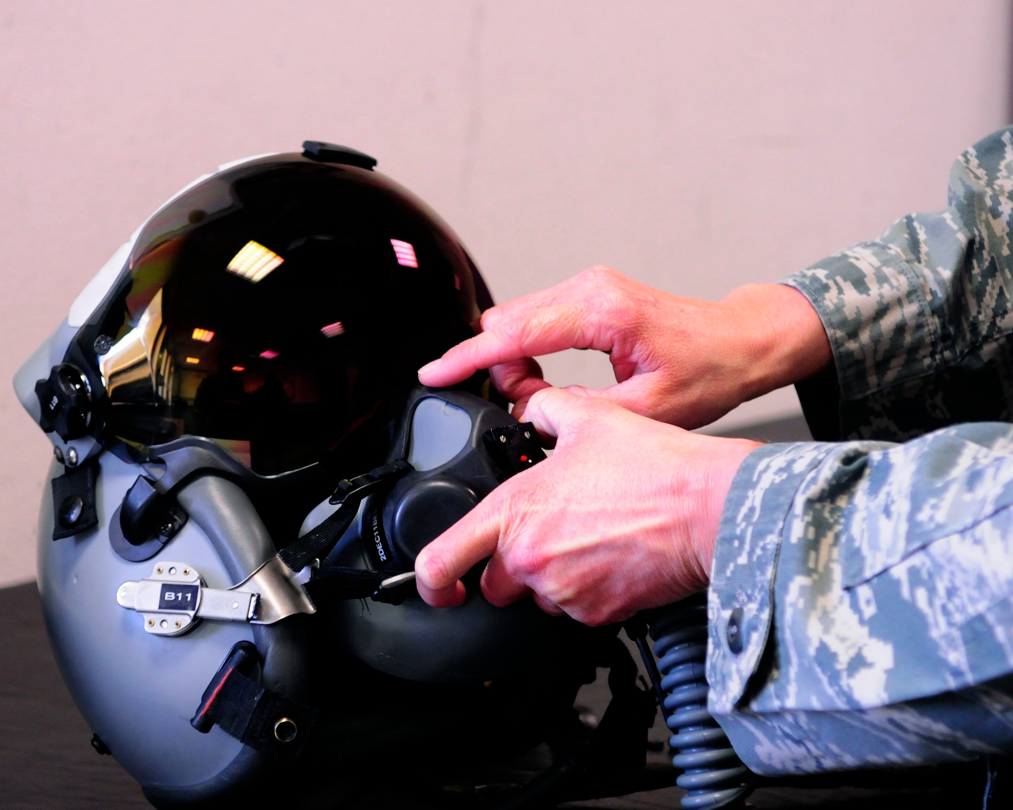 Tech. Sgt. Pamela Kelley, 31st Operations Support Squadron NCO in charge of aircrew flight equipment, adjusts a Joint Helmet Mounted Cueing System Nov. 30 at Aviano Air Base, Italy. As an aircrew flight equipment technician, Kelley performs maintenance and service inspections on all shop equipment.  (U.S. Air Force photo/Airman 1st Class Briana Jones)