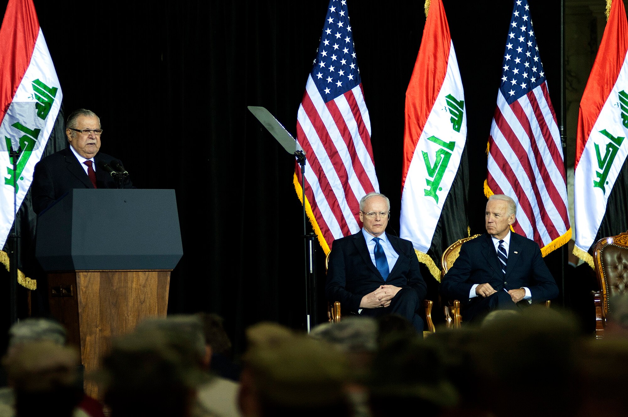 President of Iraq, Jalal Talabani, gives a speech during the Commitment Day ceremony in the Al Faw Palace at Victory Base Complex, Iraq, on Dec. 1, 2011. The Government of Iraq hosted the ceremony to commemorate the sacrifices and accomplishments of U.S. and Iraqi service members. Ambassador to Iraq, James F. Jeffrey (left) and Vice President of the United States, Joe Biden (right), were present for the ceremony. (U.S. Air Force photo/Master Sgt. Cecilio Ricardo)