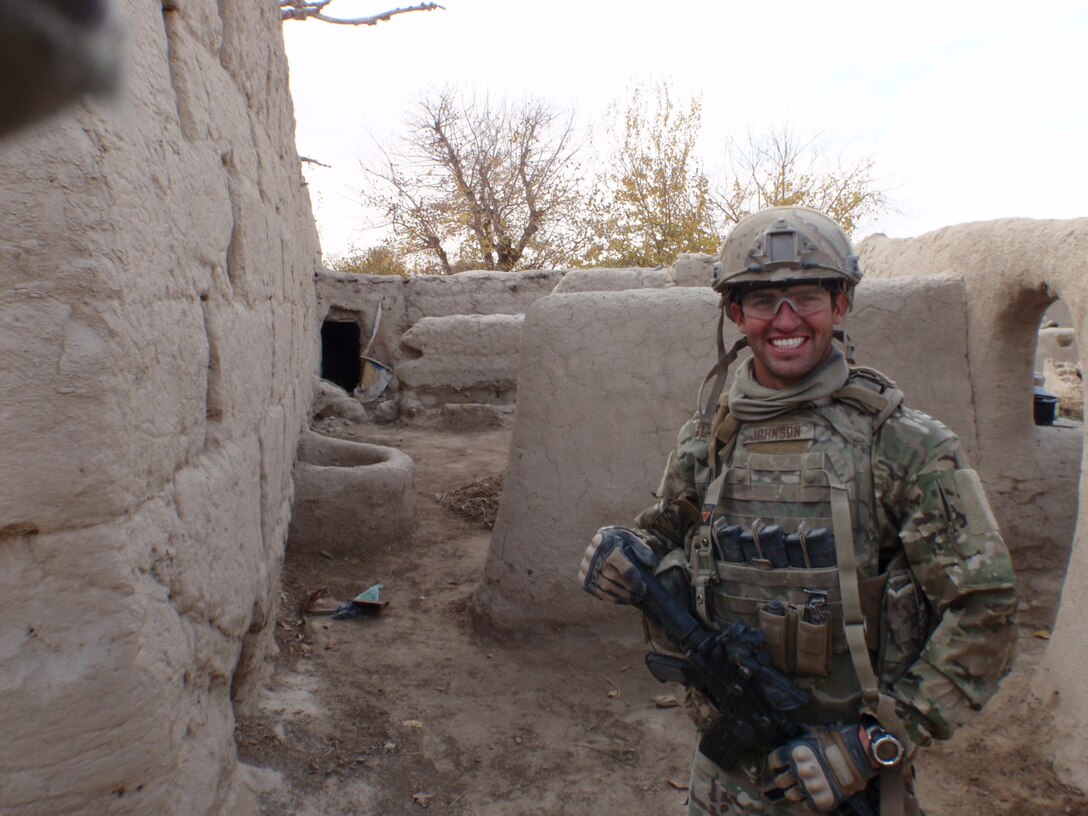 Senior Airman John Johnson, Explosive Ordnance Disposal technician with the 466th Air Expeditionary Squadron, rests while on a foot patrol in southern Kandahar province, Afghanistan, Nov. 26, 2011. Johnson was selected to receive a phone call from President Barack Obama based on his contributions to the safety of U.S., coalition and Afghan forces and civilians. (U.S. Air Force photo by Tech. Sgt. Stephen Kaufman)
