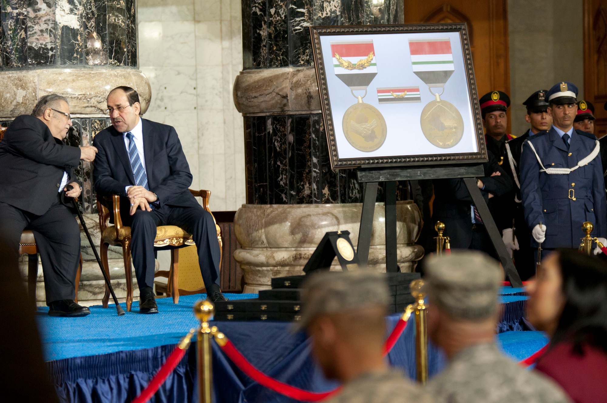 The newest award that will soon be given to service members who served in Iraq was unveiled at the ceremony. The medal is called The Medal of Commitment. Dec. 1, 2011, marks Iraq's Day of Commitment. The ceremony hosted by the Iraqi government at Al Faw Palace, in Baghdad, Iraq would be the last of it's kind as U.S. forces continue to draw out of Iraq. U.S. Vice President Joe Biden, took the opportunity to thank U.S. and Iraqi service members for all of their sacrifices that led to the end of an almost decade long war. (U.S. Army photo by Staff Sgt. Caleb Barrieau)