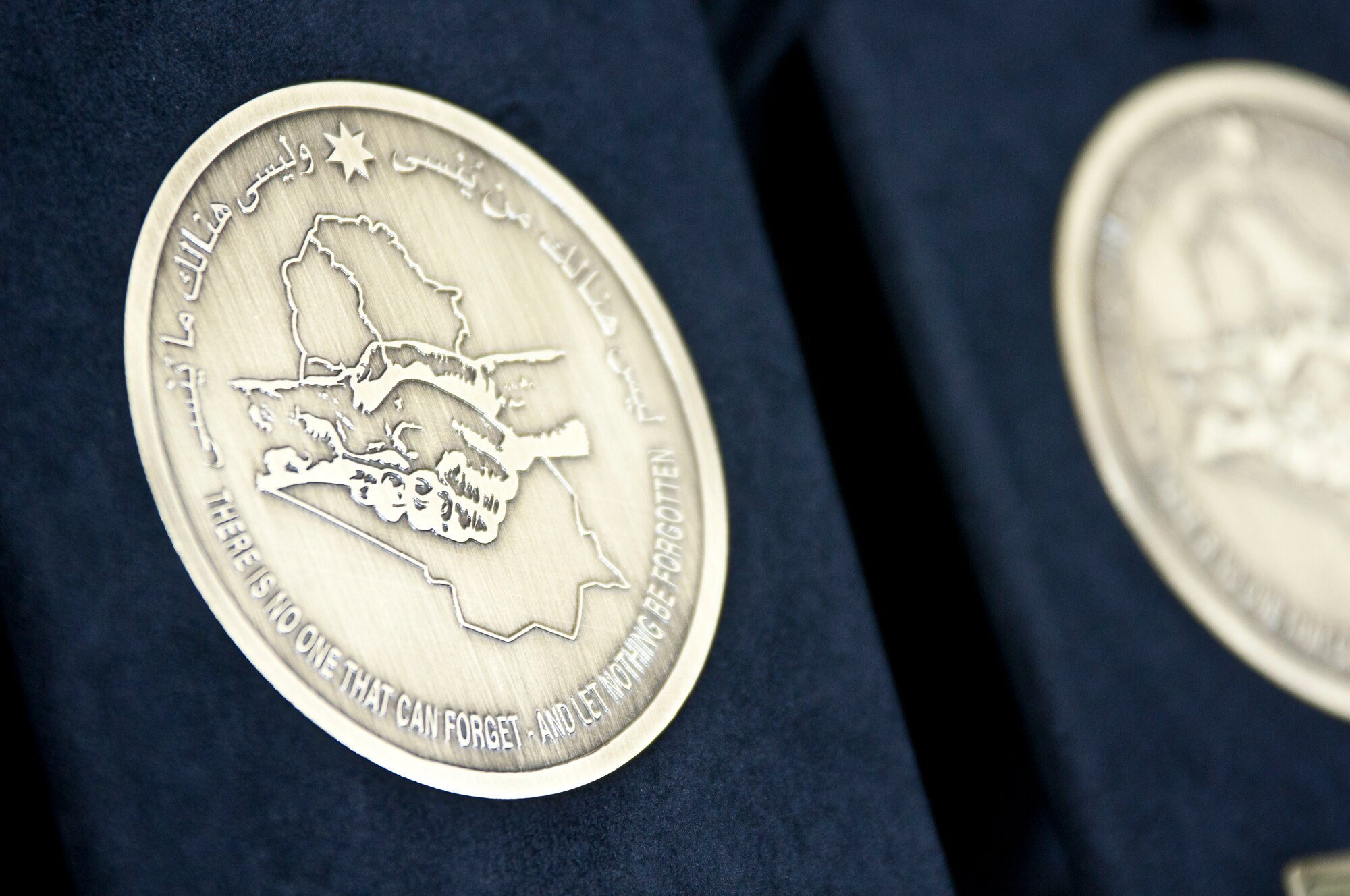 The newest award that will soon be given to service members who served in Iraq was unveiled at the ceremony. The medal is called The Medal of Commitment. Dec. 1, 2011, marks Iraq's Day of Commitment. The ceremony hosted by the Iraqi government at Al Faw Palace, in Baghdad, Iraq would be the last of it's kind as U.S. forces continue to draw out of Iraq. U.S. Vice President Joe Biden, took the opportunity to thank U.S. and Iraqi service members for all of their sacrifices that led to the end of an almost decade long war. (U.S. Army photo by Staff Sgt. Caleb Barrieau)