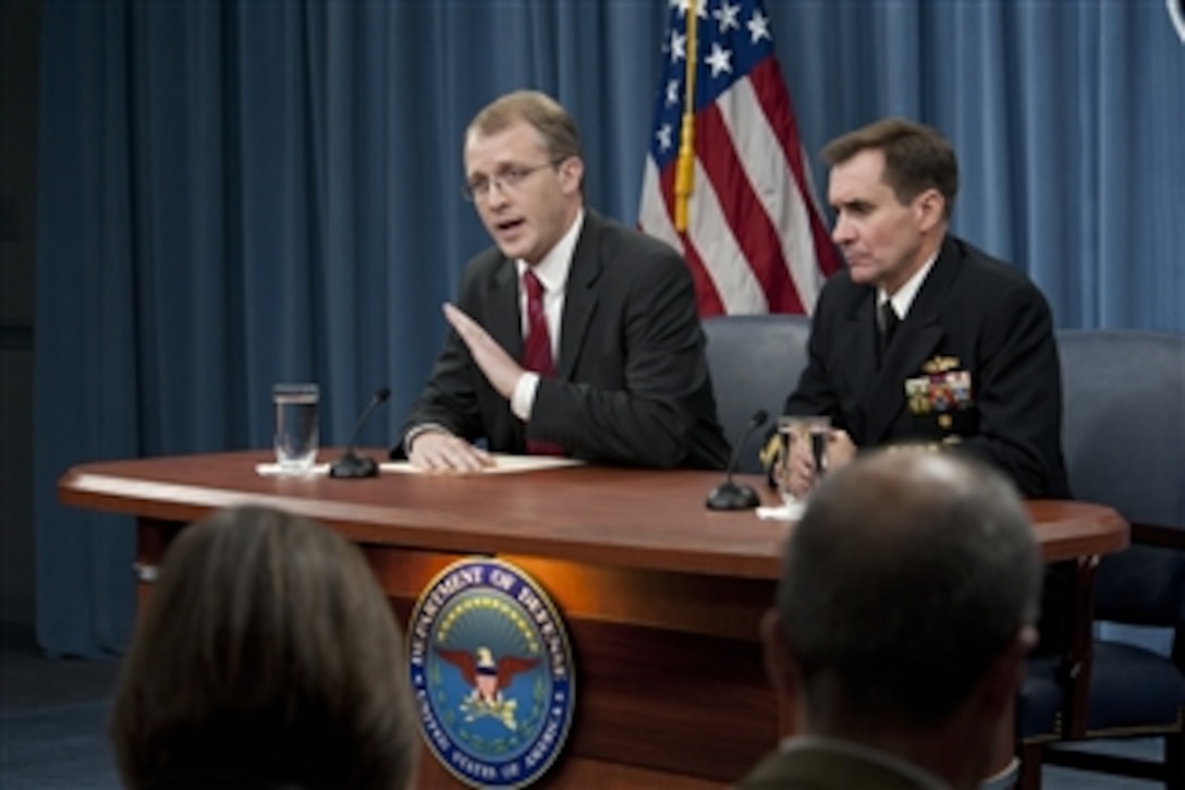 Pentagon spokesmen George Little and Capt. John Kirby brief the press in the Pentagon in Washington D.C., on December 2, 2011.  