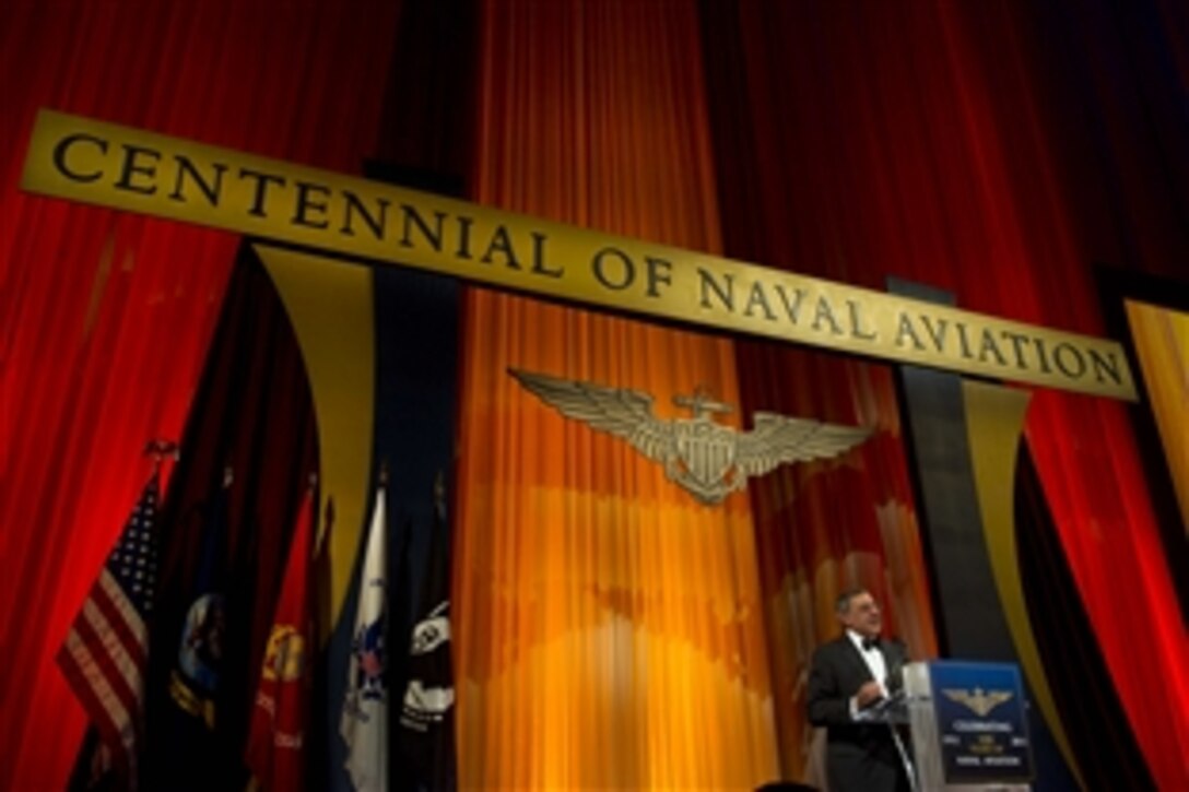 Defense Secretary Leon E. Panetta delivers the keynote address at the Centennial Commemorative Gala for Naval Aviation at the National Building Museum in Washington, D.C., Dec. 1, 2011. Panetta spoke of the leadership and valor that naval aviators from the Navy, Marine Corps and Coast Guard have shown over the last 100 years .