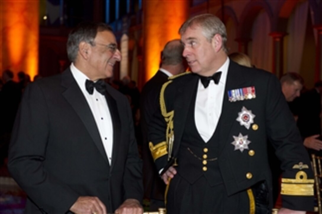 Secretary of Defense Leon E. Panetta speaks with The Duke of York Prince Andrew at the Centennial Commemorative Gala for Naval Aviation at the National Building Museum in Washington D.C., on December 1, 2011.  Panetta spoke of the leadership and valor that naval aviators from the Navy, Marine Corps and Coast Guard have shown over the last 100 years.  