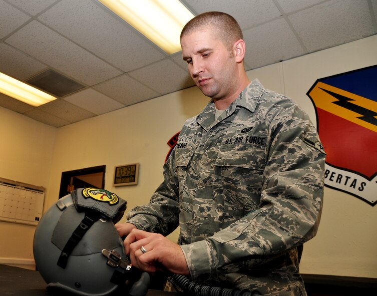 Talbot inspects a helmet of a fighter pilot to make sure each individual part is functioning correctly. Aircrew flight equipment technicians are responsible for performing inspections on all pilot equipment before and after each and every flight. (U.S. Air Force photo/Airman 1st Class Crystal Charriere)