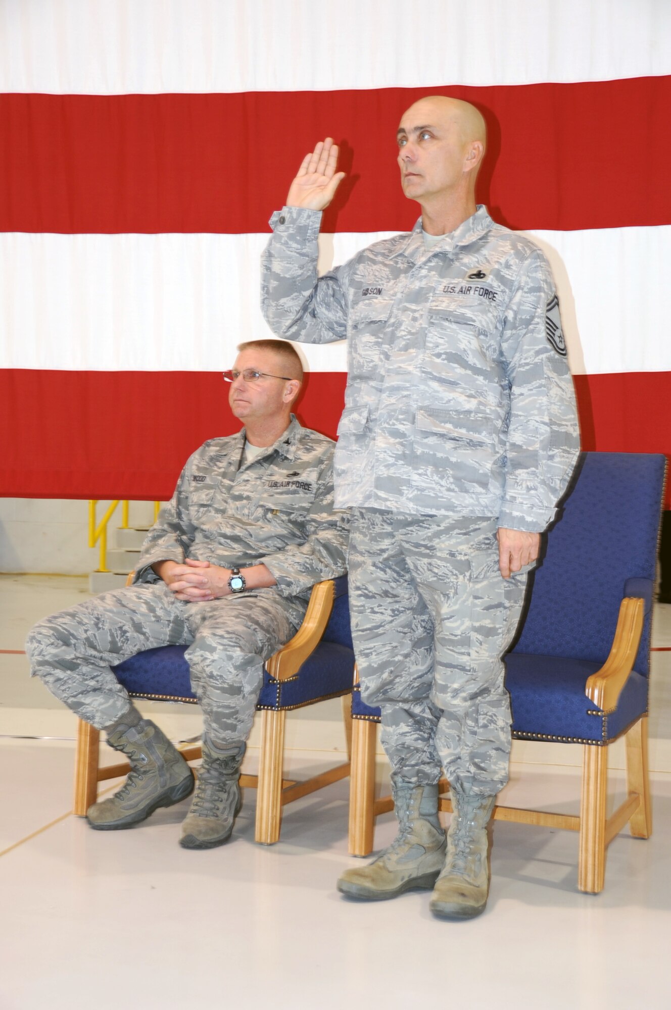 Senior Master Sgt. Kenneth Gibson, takes the chief's oath at his promotion ceremony, Dec. 1. Gibson, a weapons loader with the 442nd Aircraft Maintenance Squadron, was promoted to chief during a ceremony presided over by Col. Michael Wood, 442nd Maintenance Group commander. The 442nd MXG is part of the 442nd Fighter Wing, an A-10 Thunderbolt II Air Force Reserve unit at Whiteman Air Force Base, Mo. (U.S. Air Force photo/Staff Sgt. Danielle Wolf)