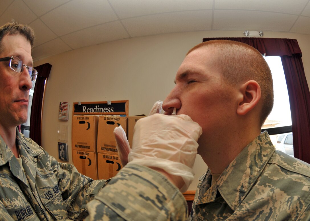 U.S. Air Force Reservists line up at the 914th Airlift Wing Family Support building to receive their annual dose of the flu vaccine, either shot or mist, during the December Unit Training Assembly at the Niagara Falls Air Reserve Station, NY.  (U.S. Air Force photo by Tech. Sgt. Joseph McKee)
