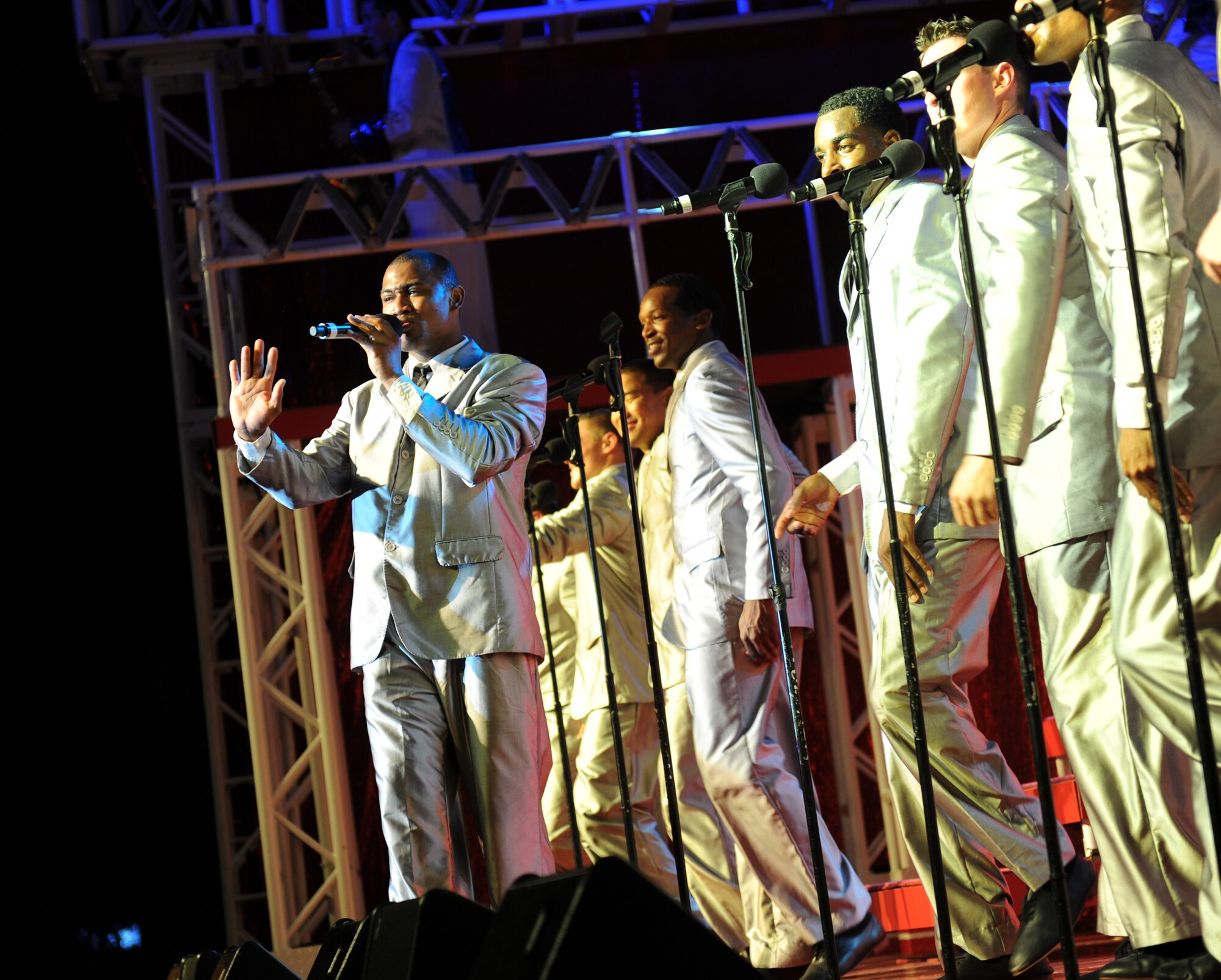 The entertainment cast from Tops in Blue performs on Freedom Tower on Joint Base Pearl Harbor-Hickam, Hawaii, Dec. 2. Each year thousands audition and compete in base talent contests in hopes of becoming a part of Tops in Blue. The result is an elite group composed of 35 of the most talented vocalists, musicians and dancers that the Air Force has to offer. (U.S. Air Force Photo/Senior Airman Lauren Main)