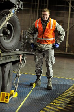 Airman 1st Class Ethan Mason, 35th Maintenance Squadron, measures cargo during an operational readiness inspection at Misawa Air Base, Japan, Dec. 4, 2011. The Pacific Air Forces Inspector General Team will spend the next week evaluating the war fighting abilities of Misawa’s airmen. (U.S. Air Force photo/Staff Sgt. Nathan Lipscomb) 
