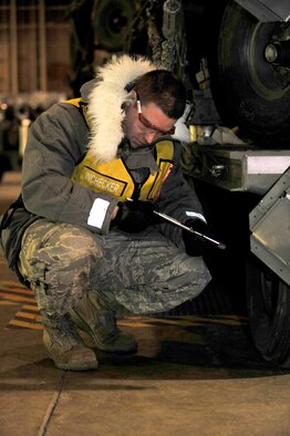 Staff Sgt. Andrew Kobal, 35th Maintenance Squadron, checks the tire pressure on a trailer during an operational readiness inspection at Misawa Air Base, Japan, Dec. 4, 2011. The Pacific Air Forces Inspector General Team will spend the next week evaluating the war fighting abilities of Misawa’s airmen. (U.S. Air Force photo/Staff Sgt. Nathan Lipscomb) 
