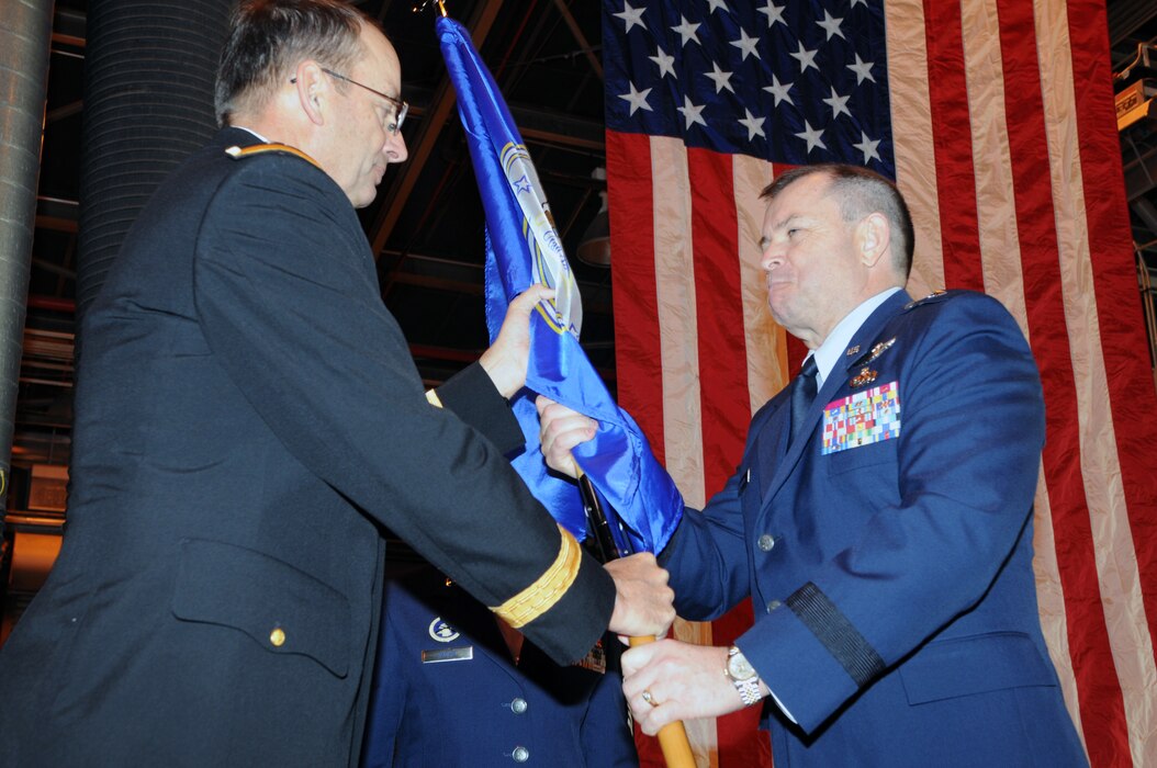 Major General Brian L. Tarbet, Utah National Guard Adjutant General, passes the colors to the incoming Assistant Adjutant General for the Utah Air National Guard, Brigadier General David R. Fountain.  During the change-of-command ceremony, Brig. Gen. Wayne E. Lee officially relinquished command as Assistant Adjutant General for Air, Joint Force Headquarters Utah National Guard, to Brig. Gen. David R. Fountain.(U.S. Air Force photo by Tech. Sgt. Kelly K. Collett)(RELEASED)