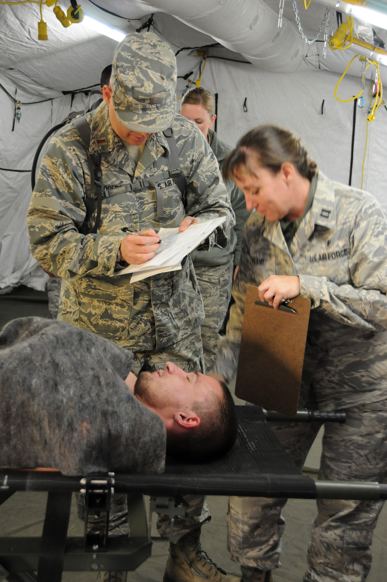 Members of the 144th Medical Group take part in specialized training during a Homeland Response Force exercise in Phoenix, Ariz. on November 5, 2011.  Capt. Veronica Repp, 144th Medical Group, helps treat a patient in triage. (USAF photo by Master Sgt. David J. Loeffler)