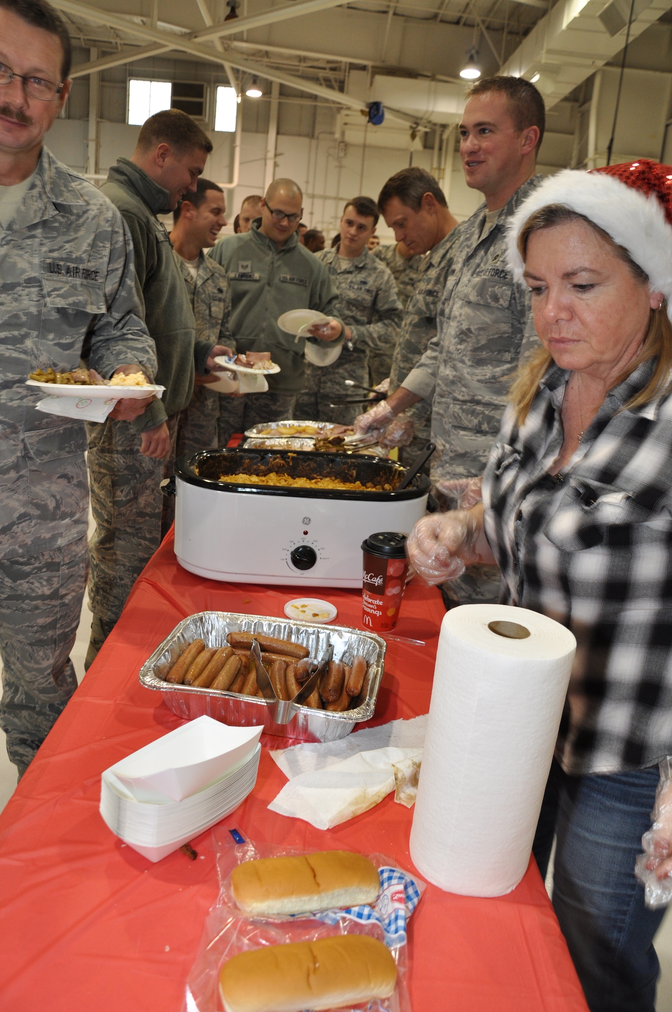 Reservists from the 442nd Maintenance Group celebrate during a holiday party, Dec. 4, 2011. Approximately 250 members of the 442nd Maintenance Group and Operations Group will deploy to Afghanistan in December 2011. The 442nd MXG and OG is part of the 442nd Fighter Wing, an A-10 Thunderbolt II Air Force Reserve unit at Whiteman Air Force Base, Mo. (U.S. Air Force photo/Tech. Sgt. Kent Kagarise)