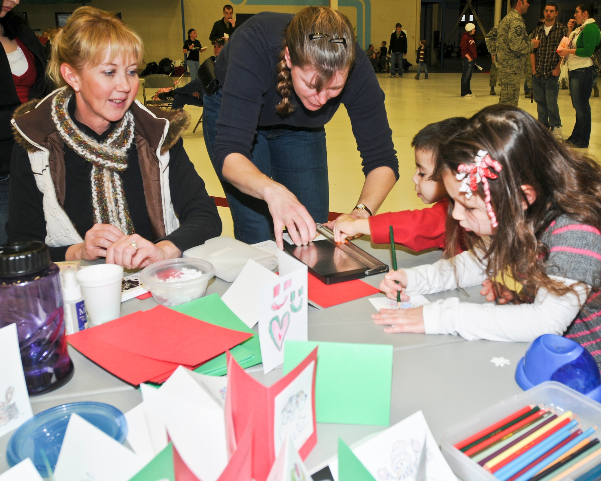 141st Air Refueling Wing members and their families enjoyed festivities at the annual Christmas party in Hanger 2050, Fairchild Air Force Base, Wash. on Dec. 3, 2011. (U.S. Air Force photos by Master Sgt Mindy Gagne)