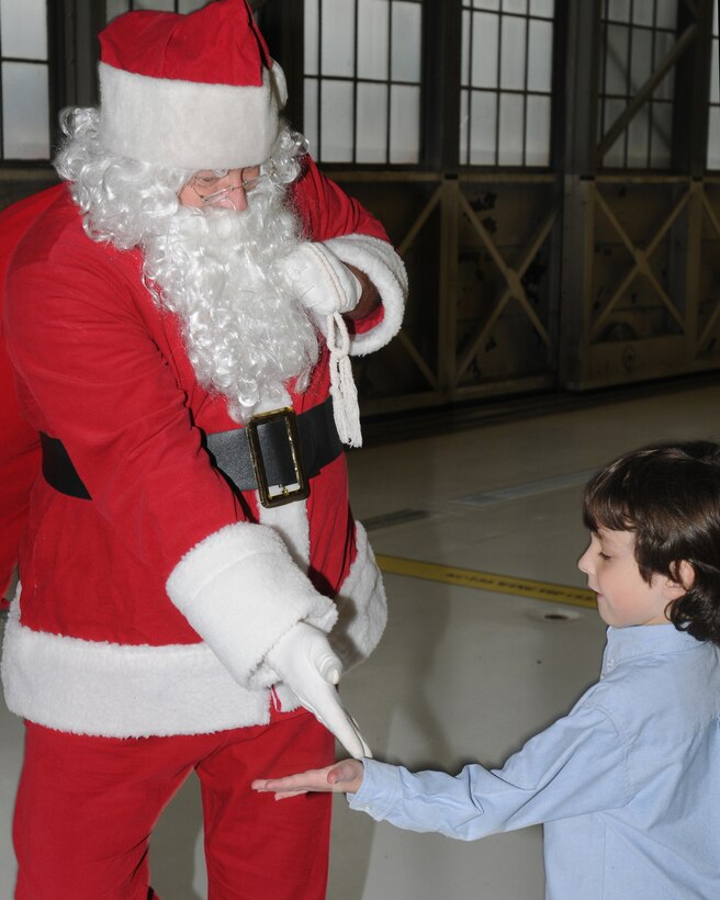 141st Air Refueling Wing members and their families enjoyed festivities at the annual Christmas party in Hanger 2050, Fairchild Air Force Base, Wash. on Dec. 3, 2011. (U.S. Air Force photos by Master Sgt Mindy Gagne)