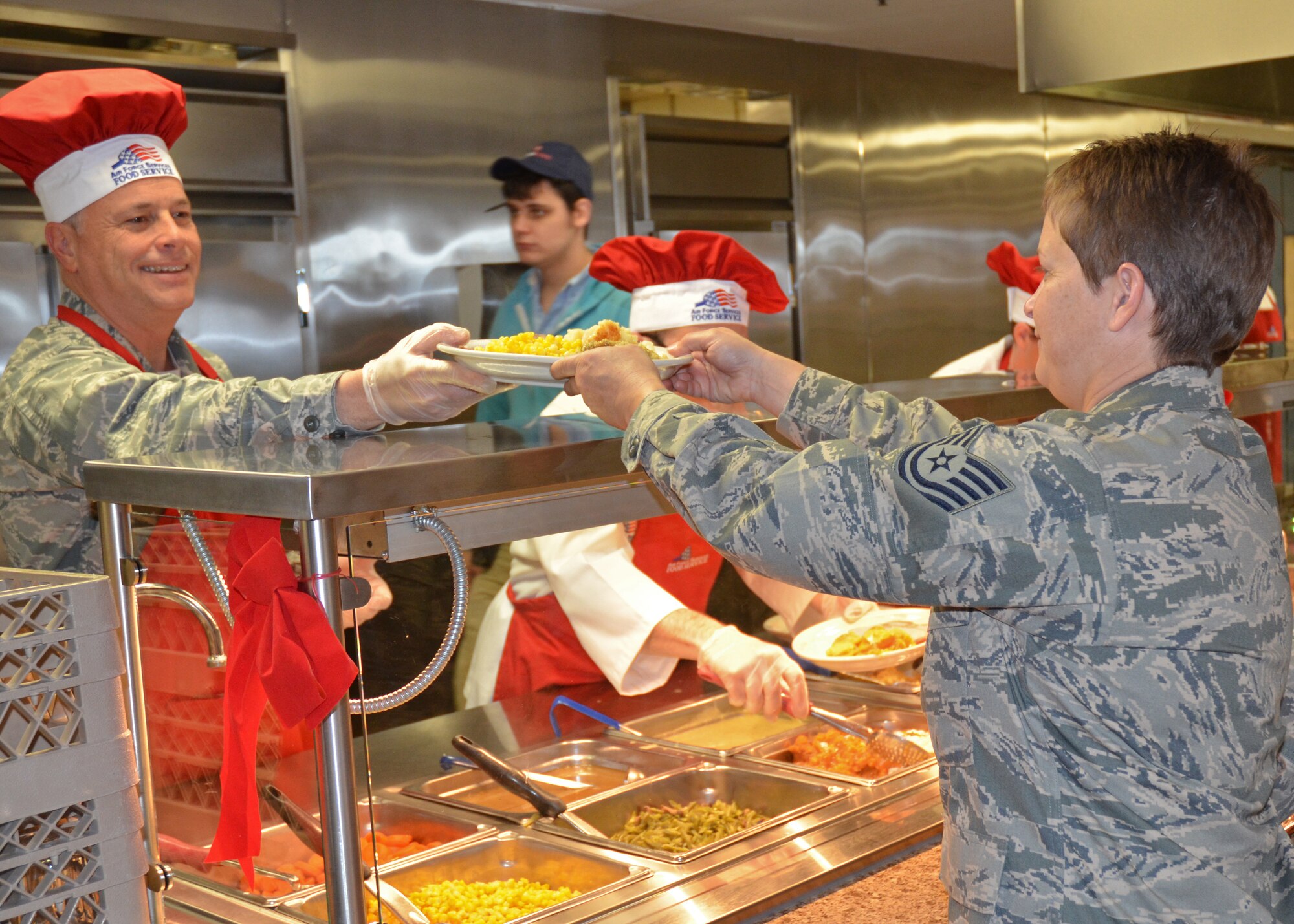 Lt. Col. Mark Visco, 512th Airlift Control Flight commander, joined other senior leadership from the 512th Airlift Wing to serve reservists a holiday meal during the Unit Training Assembly Dec. 4, 2011 at the Patterson Dining Facility, Dover Air Force Base, Del. (U.S. Air Force photo by Staff Sgt. Danella Shea/Released)