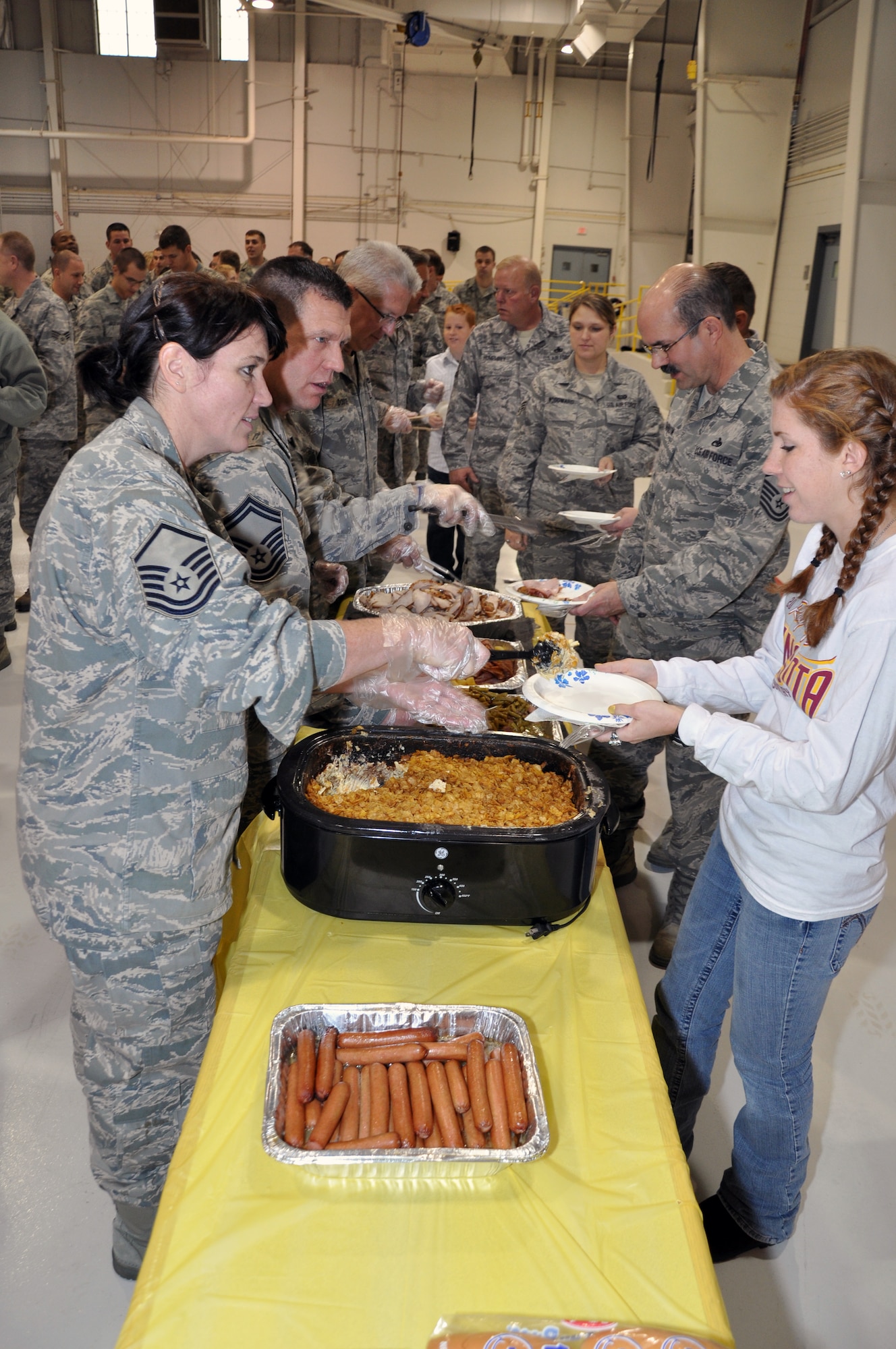 Reservists from the 442nd Maintenance Group celebrate the holidays during a party in the 5-bay hangar at Whiteman Air Force Base, Dec. 4, 2011. In December 2011, approximately 250 members of the 442nd Maintenance Group and Operations Group will deploy to Afghanistan. The 442nd MXG and OG is part of the 442nd Fighter Wing, an A-10 Thunderbolt II Air Force Reserve unit at Whiteman AFB, Mo. (U.S. Air Force photo/Tech. Sgt. Kent Kagarise)