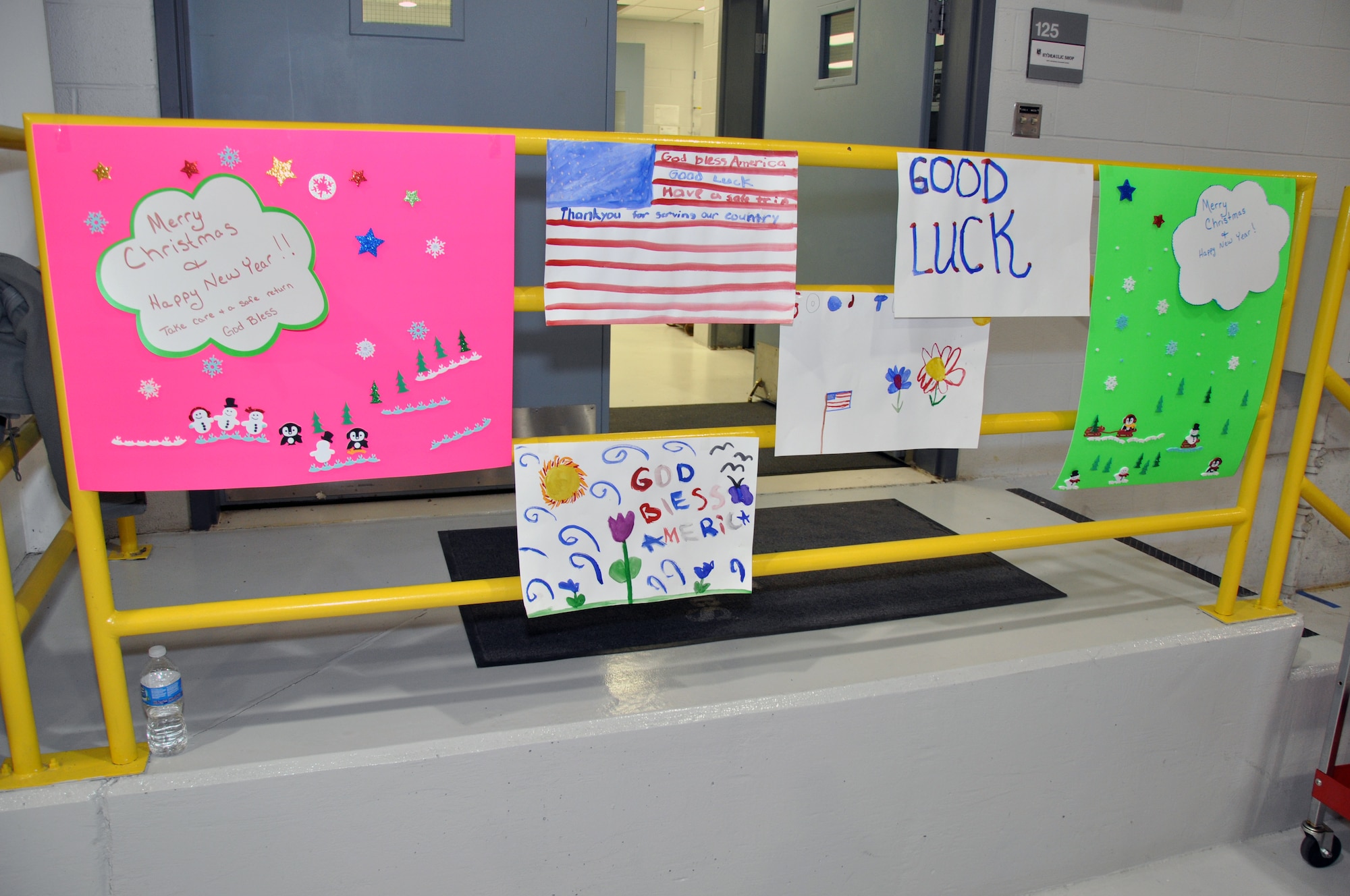 Students from the Whiteman Elementary School, Whiteman Air Force Base, Mo., created posters wishing reservists well on their upcoming deployment. In December 2011, approximately 250 members of the 442nd Fighter Wing will deploy to Afghanistan. The 442nd Fighter Wing is an A-10 Thunderbolt II Air Force Reserve unit at Whiteman AFB, Mo. (U.S. Air Force photo/Tech. Sgt. Kent Kagarise)