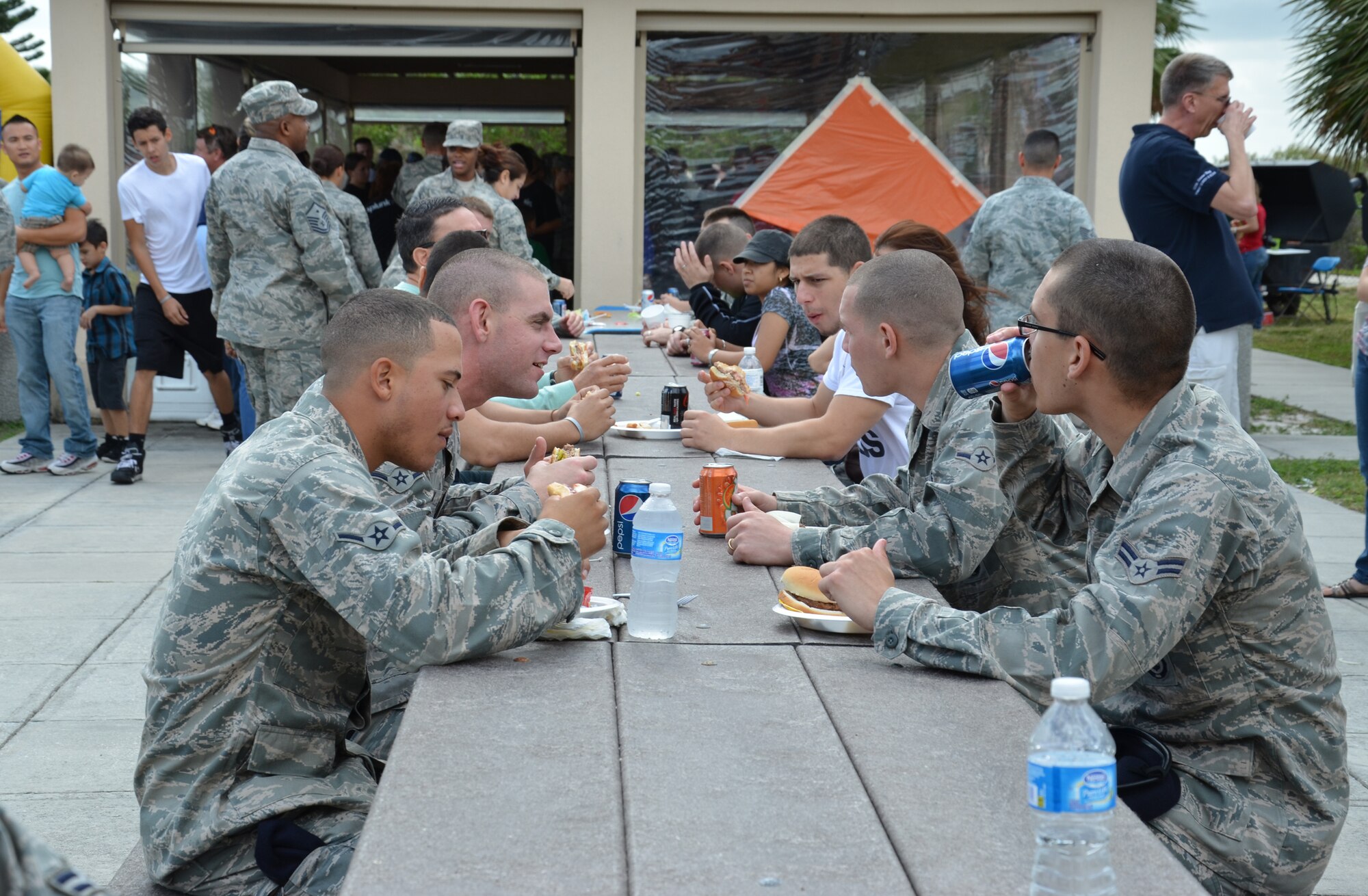 PATRICK AIR FORCE BASE, Fla.- Reserve Airmen chow down during the family holiday picnic Dec. 3. The 920th Rescue Wing trains and equips approximately 1,700 Airmen to search for, locate and recover U.S. Armed Forces personnel during military operations. (U.S. Air Force photo/Staff Sgt. Anna-Marie Wyant)
