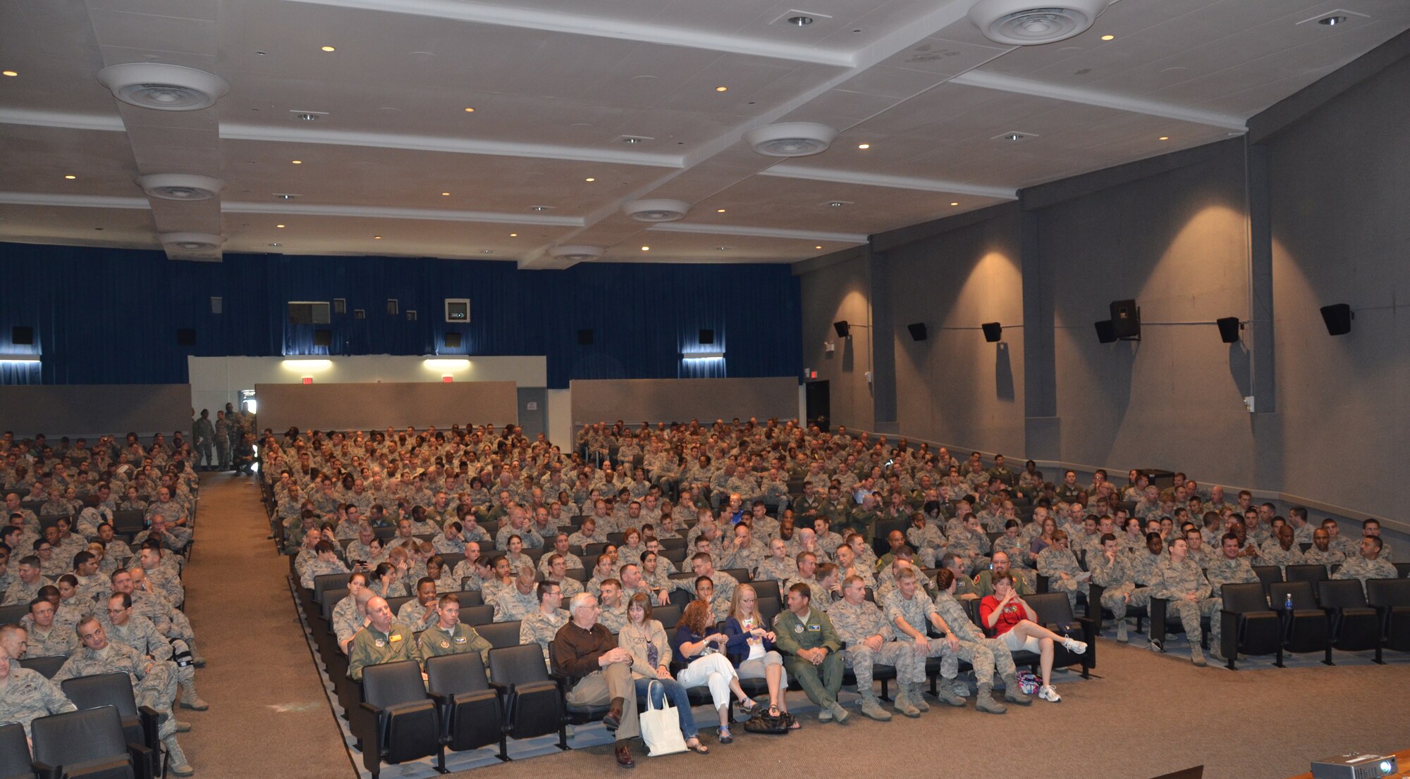 PATRICK AIR FORCE BASE, Fla.- The base theater here was packed full of Rescue Reservists and their family members to hear the wing commander, Col. Jeffrey Macrander, speak at the Commander's Call Dec. 3. Colonel Jeffrey Macrander gave words of encouragement and updated wing members, and a few family members, who joined in, on matters of concern and wing events and activities during the event. (U.S. Air Force photo/Capt. Ryan Liss)