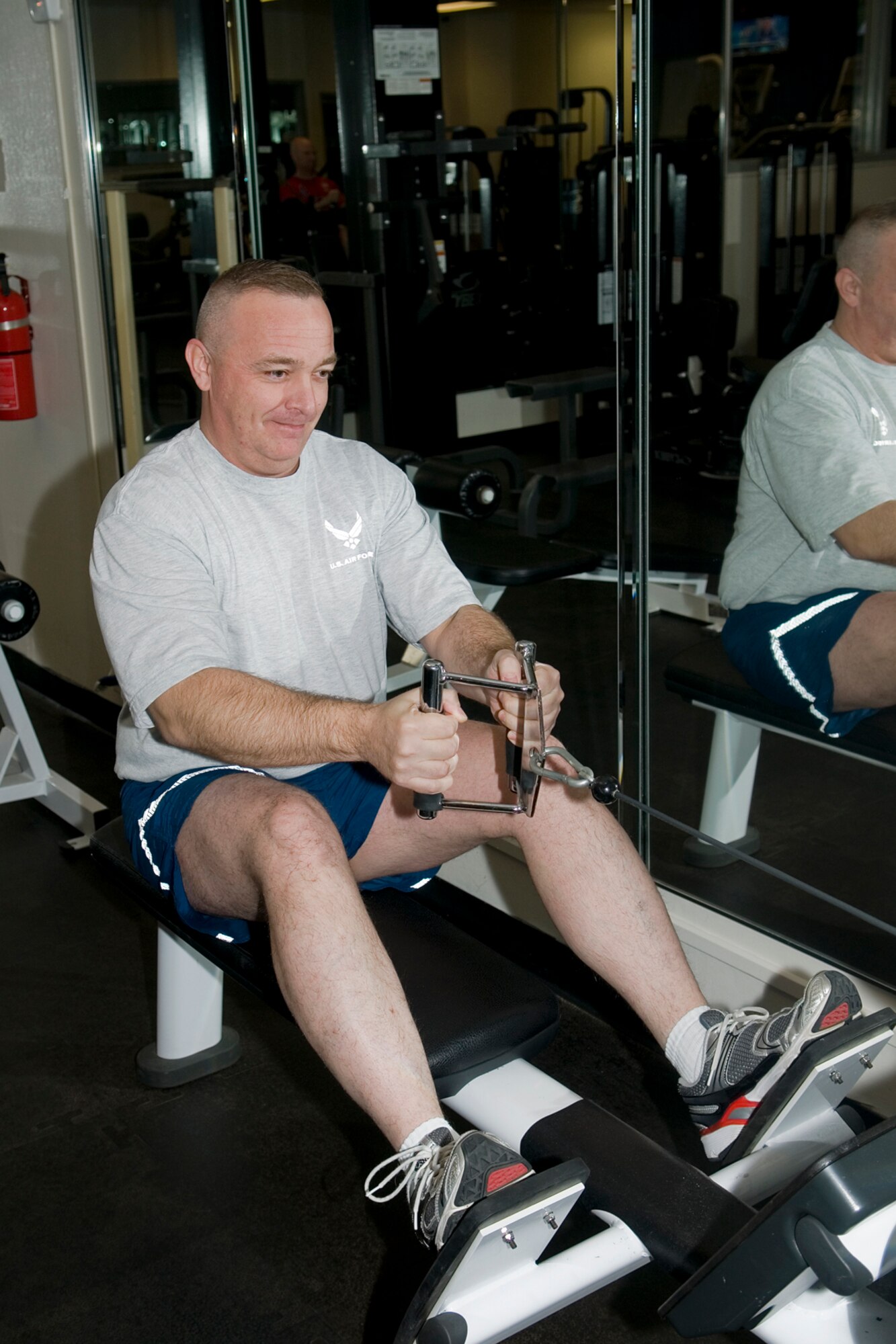 GRISSOM AIR RESERVE BASE, Ind. -- Master Sgt. Michael Kamp, 434th Security Forces Squadron unit deployment manager, hits the weights to maintain his fit to fight standards. Kamp overcame his own odds and beat the scale, losing a total of 45 pounds in a matter of months. (U.S. Air Force photo/ Senior Airman Jami K. Lancette)	 