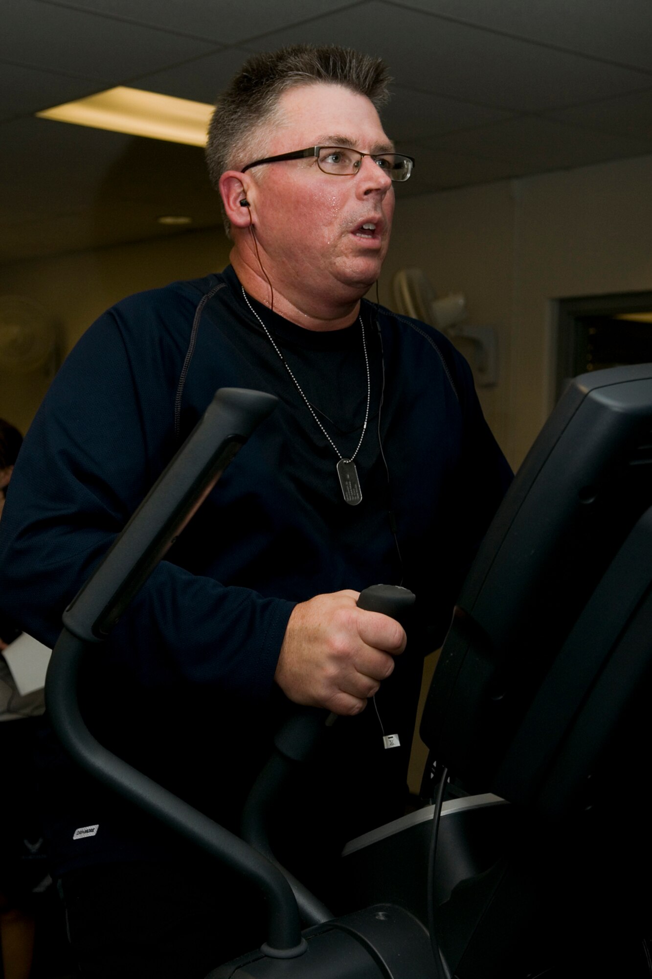 GRISSOM AIR RESERVE BASE, Ind. -- Tech Sgt. Doug Hays, 434th Air Refueling Wing public affairs superintendant, sweats it out at Grissom's fitness center. Hays lost 40 pounds in his quest to be fit to fight. (U.S. Air Force photo/Senior Airman Jami K. Lancette)
