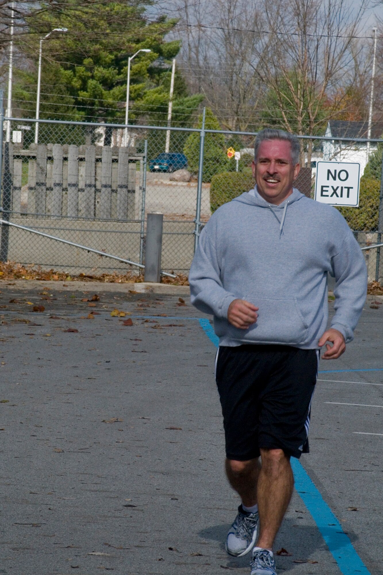 GRISSOM AIR RESERVE BASE, Ind. -- Master Sgt. Robert Sucharski, 434th Maintenance Operations Flight maintenance operations coordinator, crosses the finish line during the 5-kilometer 'turkey trot.". Sucharski said he has more energy since losing 45 pounds. (U.S. Air Force photo/ Senior Airman Jami K. Lancette)