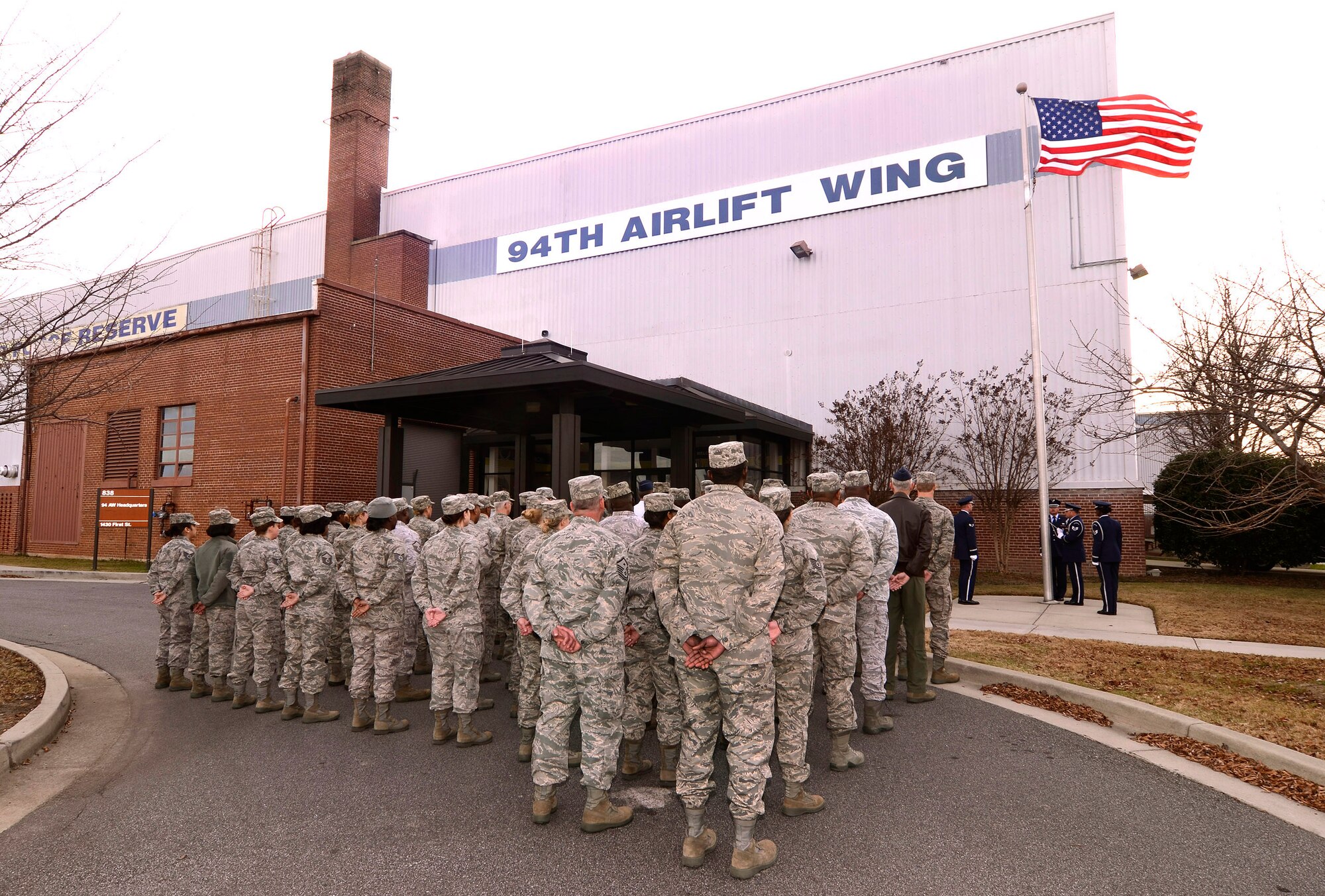 Wing staff members of the 94th Airlift Wing, stand by to perform a retreat ceremony for the December Unit Training Assembly at Dobbins Air Reserve Base, Ga, Dec. 3.  (U.S. Air Force photo/ Brad Fallin)