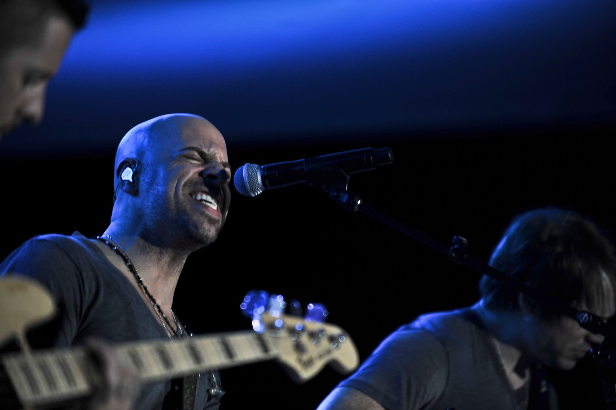 Chris Daughtry, lead singer for the quintuple-platinum band “Daughtry,” performs for service members during a concert at the Memorial Plaza Dec. 2, 2011, at an undisclosed location in Southwest Asia. The rock band Daughtry, comedian Gabriel Iglesias and members of the Band of the U.S. Air Force Reserve began their 13-day tour playing six concerts that will take them through Southwest Asia and Europe to bring entertainment to American troops and their families as part of the 2011 Operation Seasons Greetings Tour for the Troops. (U.S. Air Force photo/Senior Airman Paul Labbe)