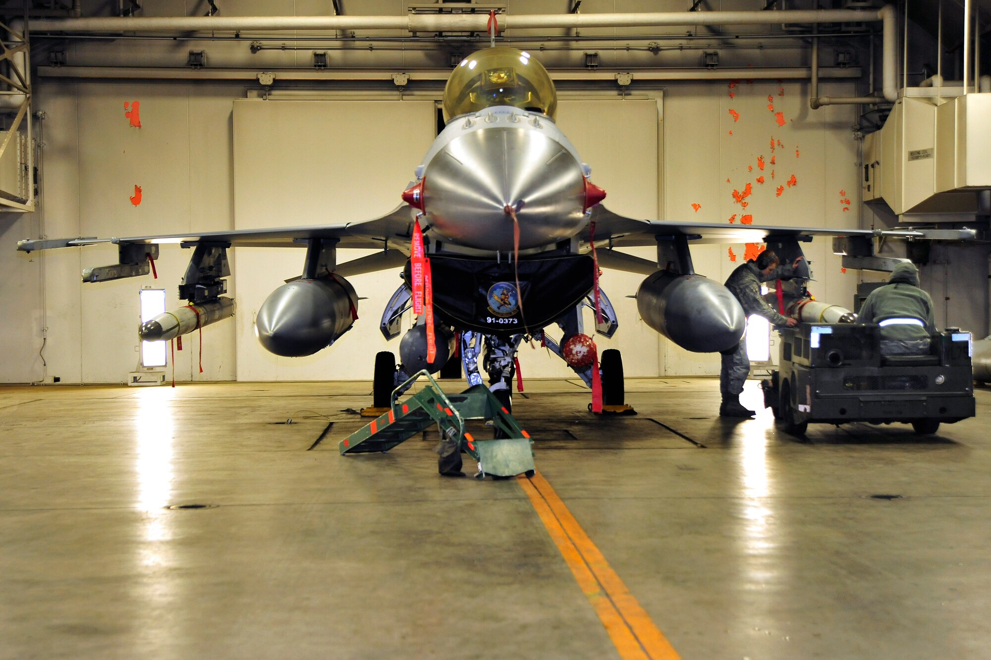 MISAWA AIR BASE, Japan – Members of the 13th Aircraft Maintenance Unit, load simulated munitions on an F-16 Fighting Falcon during an operational readiness inspection here Dec. 5. The Pacific Air Forces Inspector General Team is spending the next couple of days evaluating the war fighting abilities of Misawa’s airmen. (U.S. Air Force photo/Staff Sgt. Nathan Lipscomb)