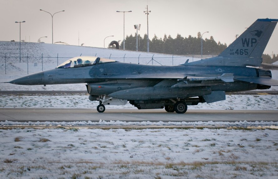 MISAWA AIR BASE, Japan – A pilot taxis an F-16 Fighting Falcon from a hardened shelter here Dec. 5. The F-16, belonging to the 35th Fighter Squadron at Kunsan Air Base, South Korea, will be used to simulate an “aggressor” aircraft during the 35th Fighter Wing’s Operational Readiness Inspection happening this week. The inspection allows airmen here to showcase their ability to transition from peacetime readiness to a wartime posture. (U.S. Air Force photo/Senior Airman Jess Lockoski) 