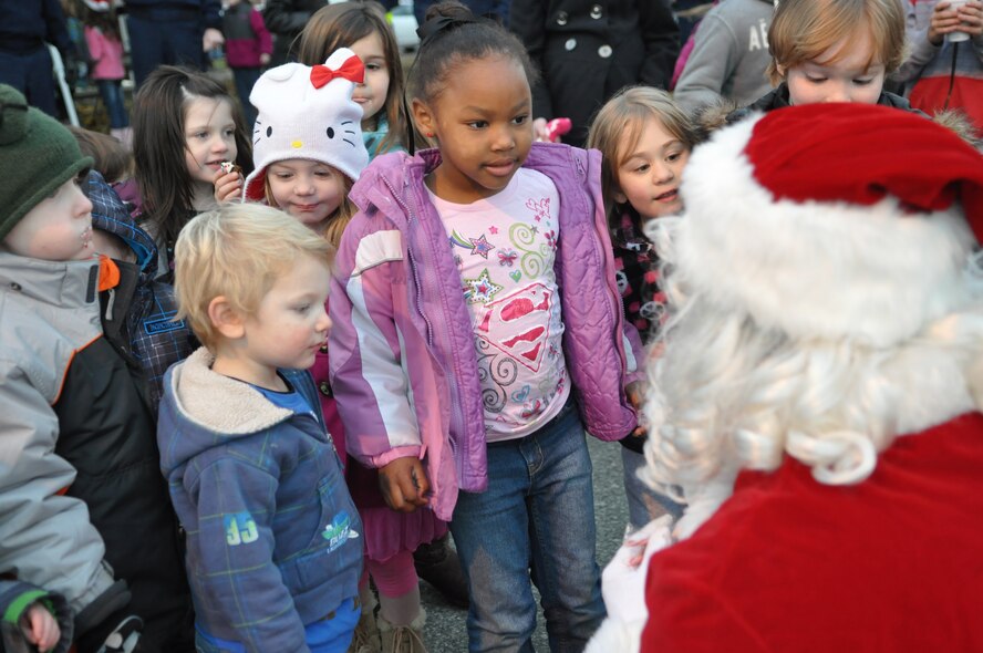 Children wait to receive candy from Santa Claus during the McChord Field annual tree lighting ceremony Dec. 5, 2011, at Joint Base Lewis-McChord, Wash. (U.S. Air Force photo/Airman 1st Class Leah Young)