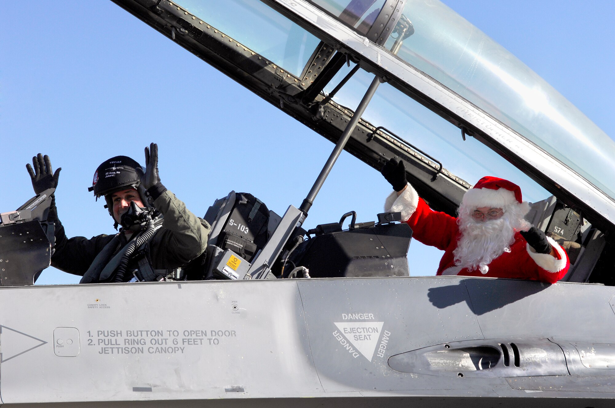 U.S. Air Force Lt. Col. Johnny Vargas, 77th Fighter Squadron commander, sits in a F-16 Fighting Falcon after flying Santa to Shaw for the 20th Operations Group Christmas Party, Shaw Air Force Base, S.C. Dec. 3, 2011. (U.S. Air Force photo by Airman 1st Class Ashley L. Gardner/ Released)