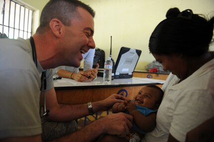 Capt. Eric Baroni, a Joint Task Force-Bravo Medical Element physician’s assistant, performs a check up on a Honduran baby during a Medical Readiness Training Exercise Nov. 29, 2011, at a school in Choluteca, Honduras.  (U.S. Air Force photo/Tech. Sgt. Matthew McGovern)      