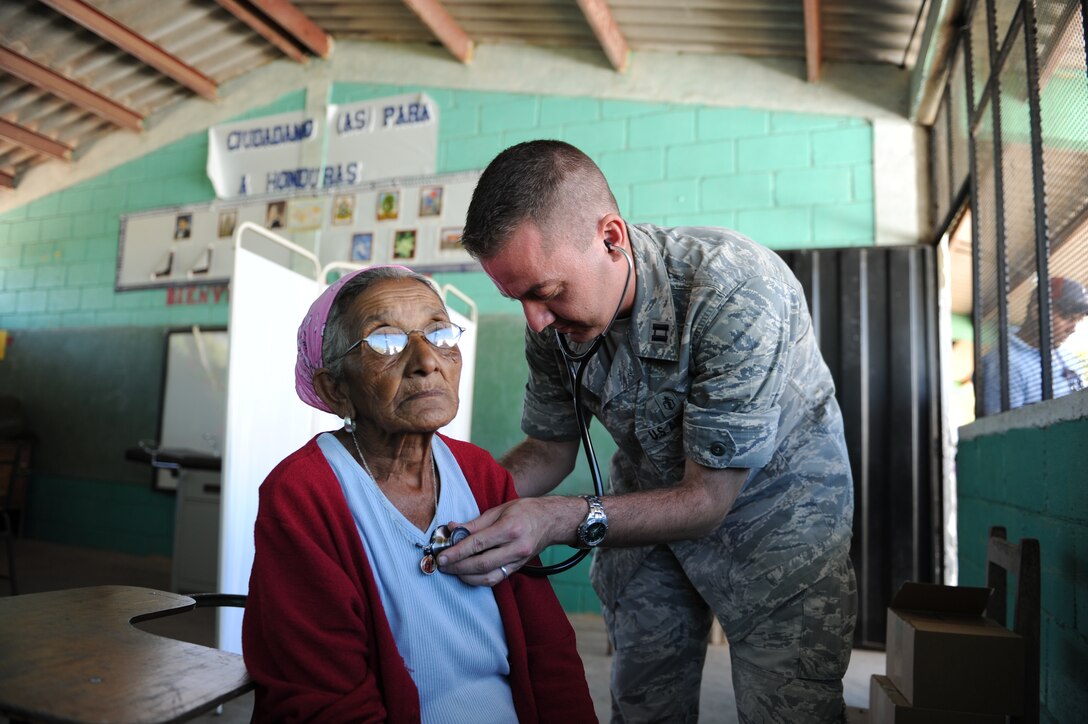 Capt. Eric Baroni, a Joint Task Force-Bravo Medical Element physician’s assistant, performs a check up on a Honduran woman during a Medical Readiness Training Exercise Nov. 29, 2011, at a school in Choluteca, Honduras. (U.S. Air Force photo/Tech. Sgt. Matthew McGovern)    )       