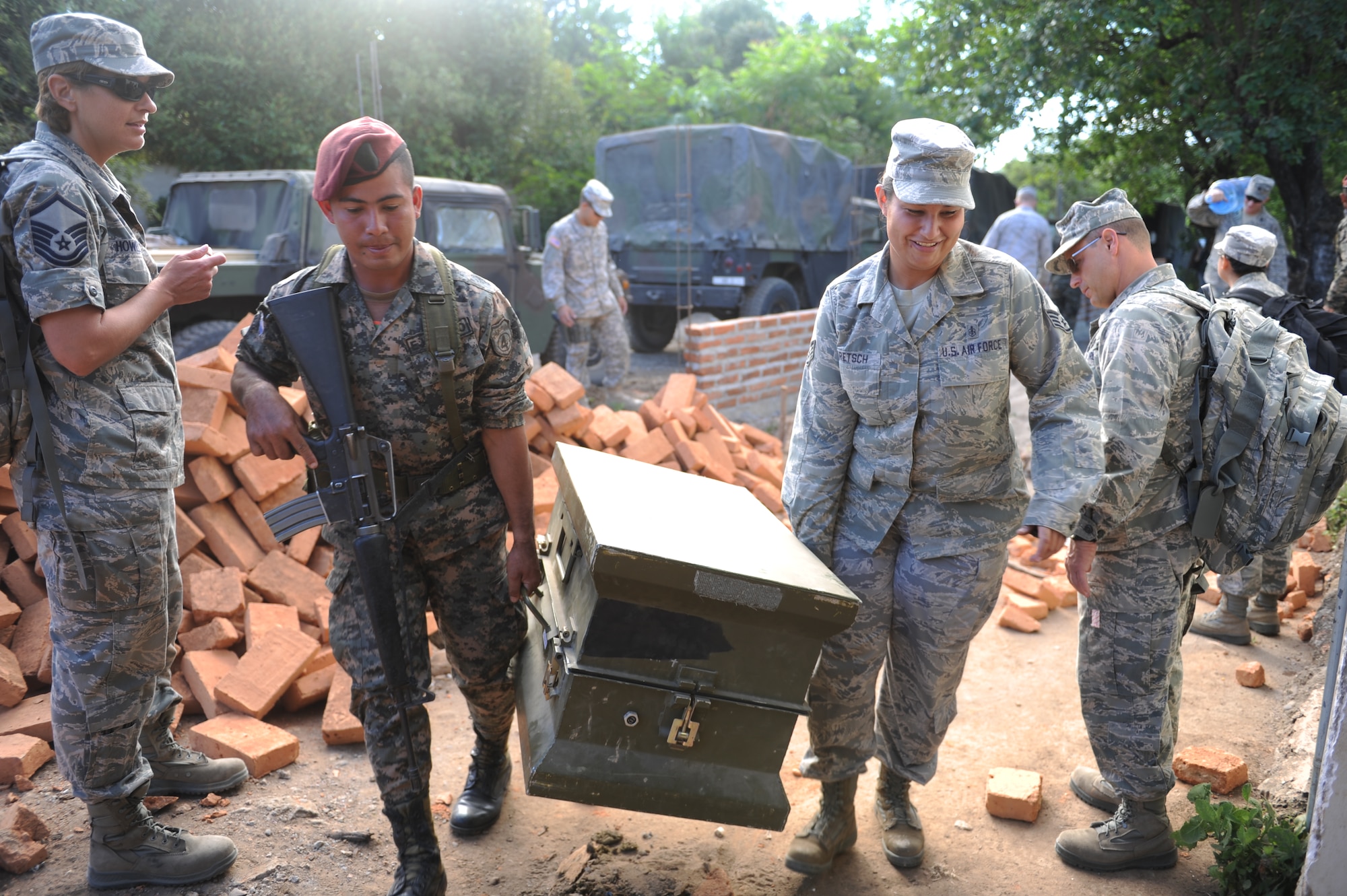 Honduran Army personnel and Joint Task Force-Bravo Medical personnel unload medical supplies during a Medical Readiness Training Exercise Nov. 29, 2011, at a school in Choluteca, Honduras.  More than 20 medical personnel from JTF-Bravo along with their Honduran partners, back rounding in various medical fields, military members, Boy Scouts, and the Honduran Ministry of Health, provided general medical care to over 2,800 flood victims. (U.S. Air Force photo/Tech. Sgt. Matthew McGovern)    