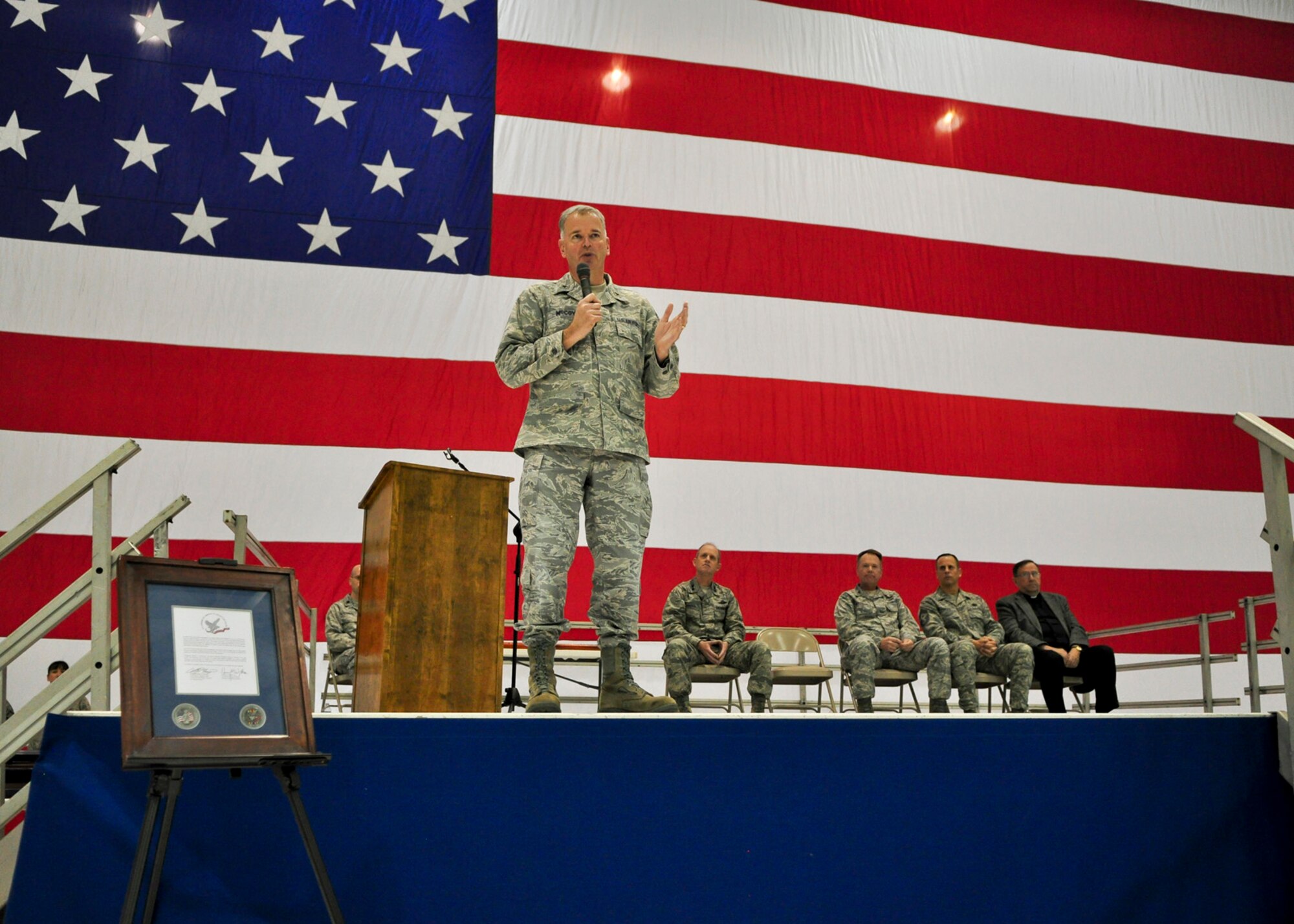 Brig. Gen. John E. McCoy, Wisconsin's assistant adjutant general for Air, addresses a gathered crowd of Airmen and family members during a Hometown Heroes Salute Campaign award ceremony at the 128th Air Refueling Wing, Milwaukee, on Sunday, December 4, 2011.  Gen. McCoy applauded the recipient Airmen's ability to "do the work America asks of us."  The Hometown Heroes Salute Campaign is an Air National Guard event that recognizes Airmen who have deployed overseas for more than 30 days.  Air National Guard photo by Tech. Sgt. Tom Sobczyk.