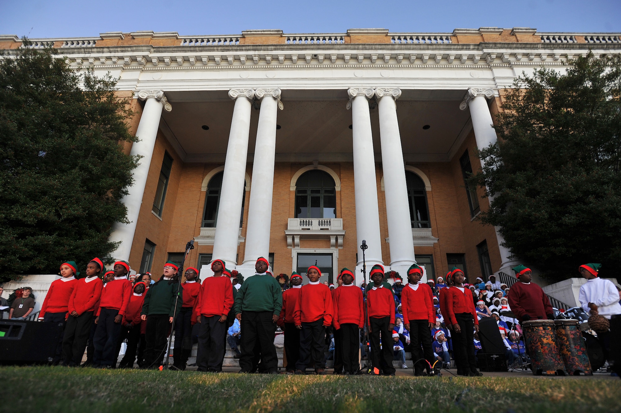 Children from Lemira Elementary School, perform in front of the Sumter County Courthouse as part of Sumter's Christmas Tree Lighting Ceremony, Dec. 2, 2011, Sumter, S.C. The annual ceremony brought out the holiday spirit as several elementary school choirs performed Christmas carols for those who gathered at the courthouse to witness the celebration. (U.S. Air Force photo by Senior Airman Kenny Holston/Released)


