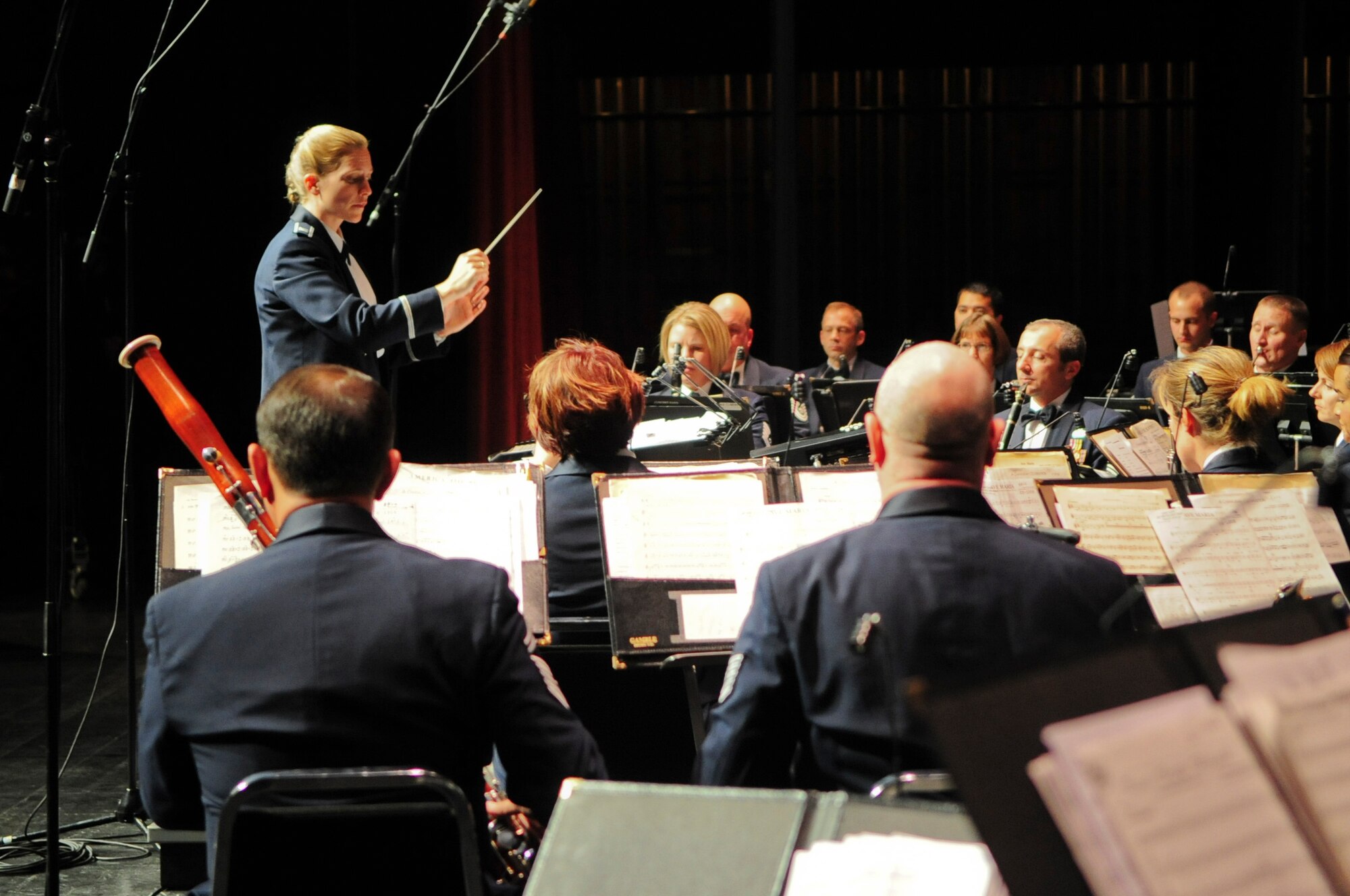 Capt. Haley Armstrong, commander and conductor of the United States Air Force Band of the Golden West, directs the band during a holiday concert performance at the Sacramento Convention Center Nov. 30, 2011. The Band of the Golden West plays as many as 350 performances, ceremonies and military events every year, and can be broken into six smaller groups including a rock band. (U.S. Air Force photo by Staff Sgt. Sarah Brown/RELEASED)